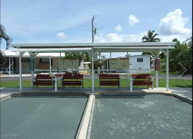 a view of a wooden deck with a lake view