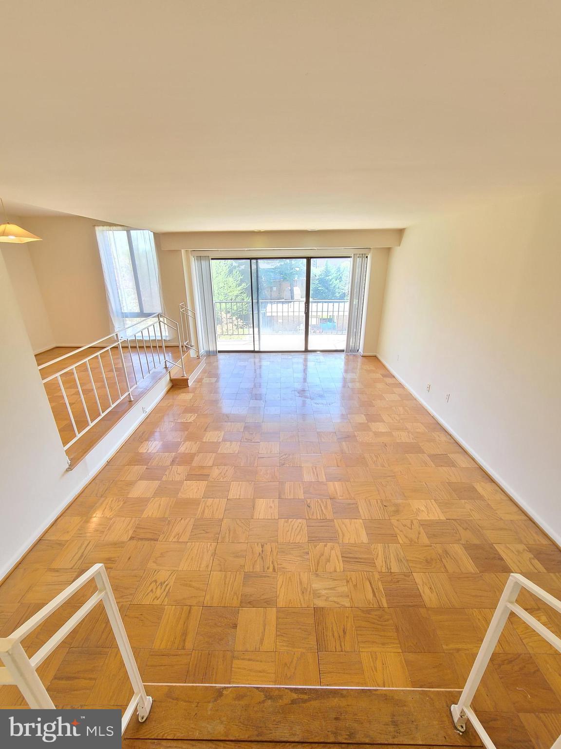 9900 Georgia Avenue, Unit 310 Silver Spring, MD 20902 - Photo 3 of 16 a view of an empty room with a window