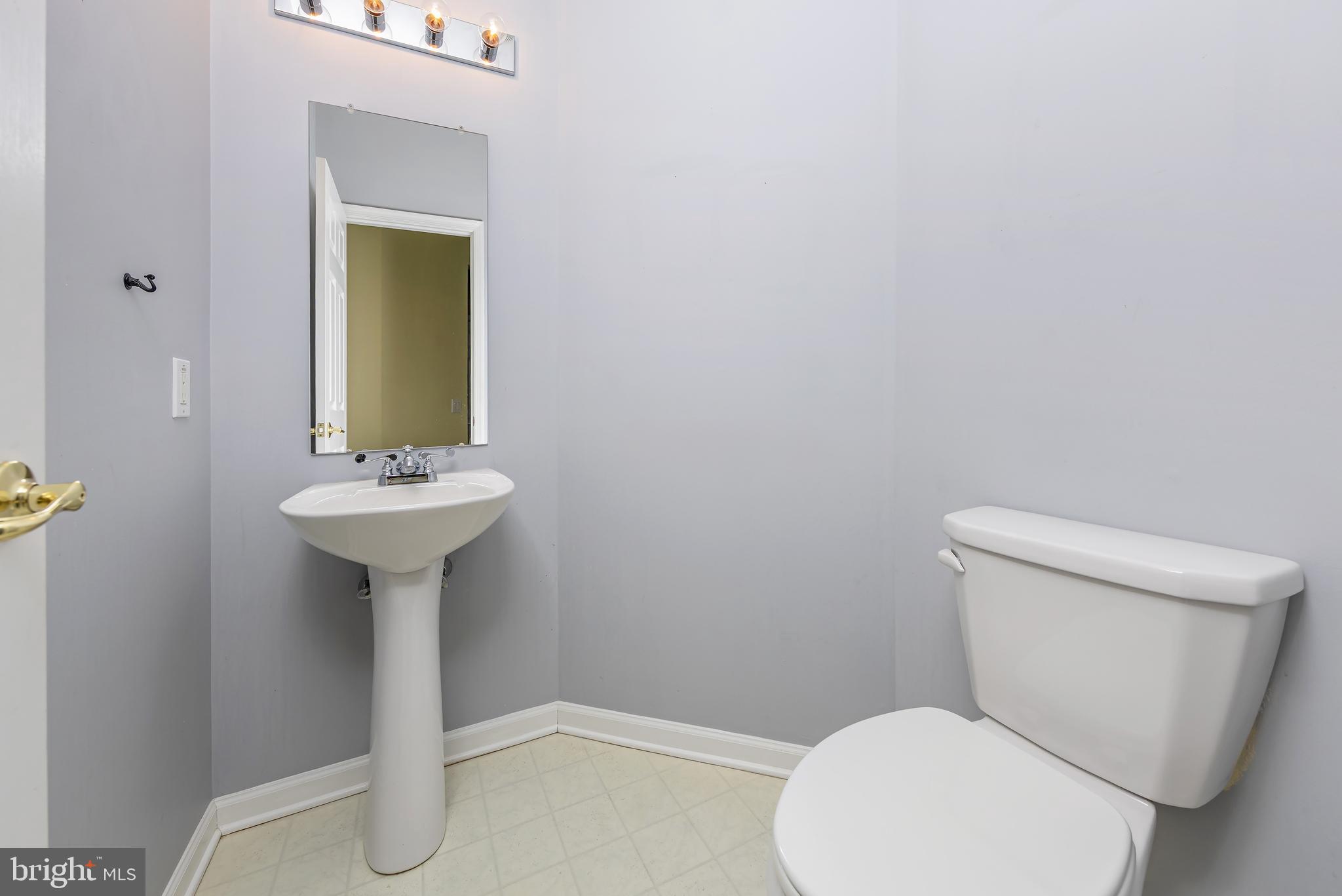 137 Merion Way Hainesport, NJ 08036 - Photo 13 of 26 a bathroom with a sink toilet and a mirror