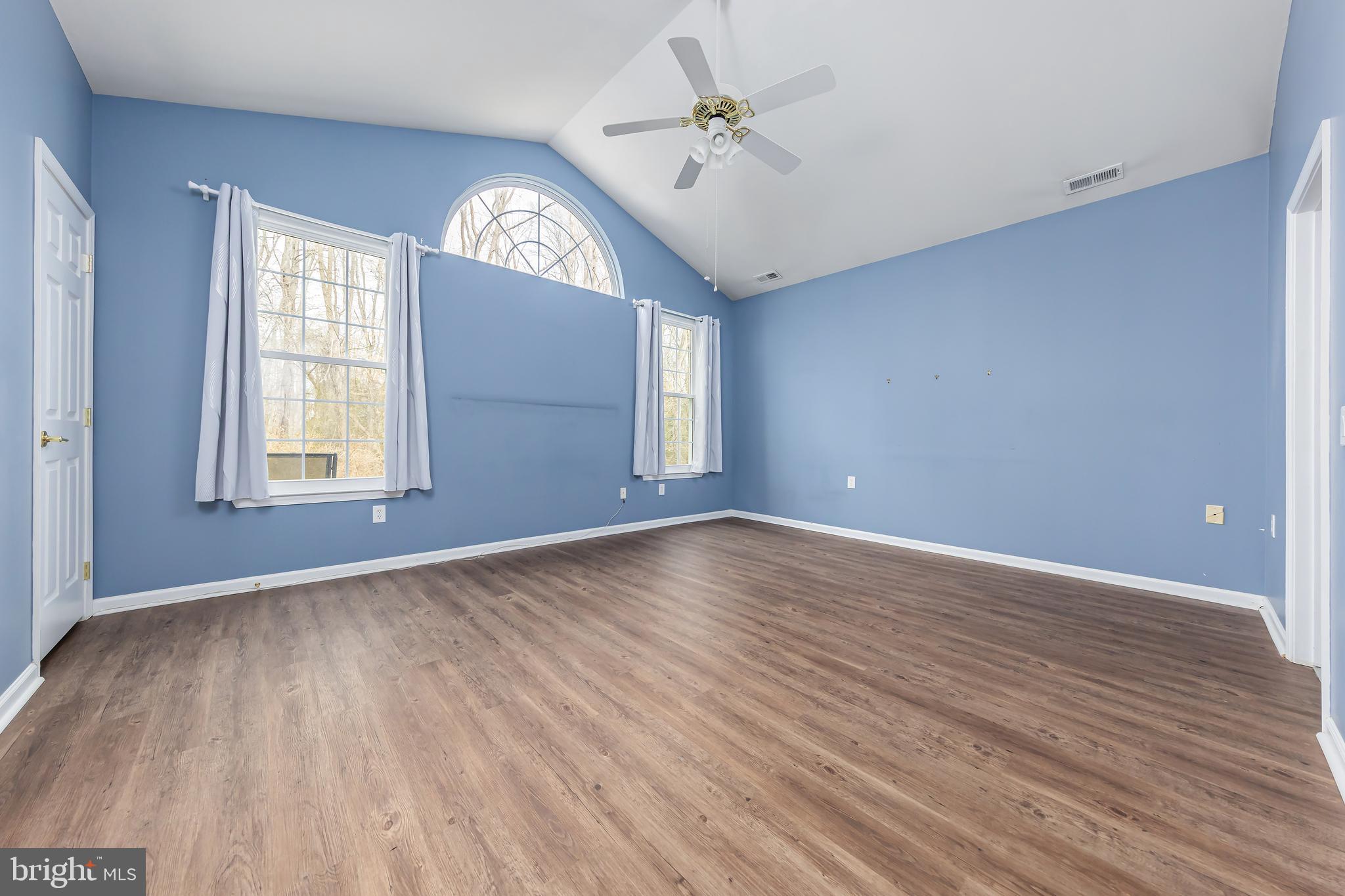 137 Merion Way Hainesport, NJ 08036 - Photo 16 of 26 a view of an empty room with wooden floor and a window