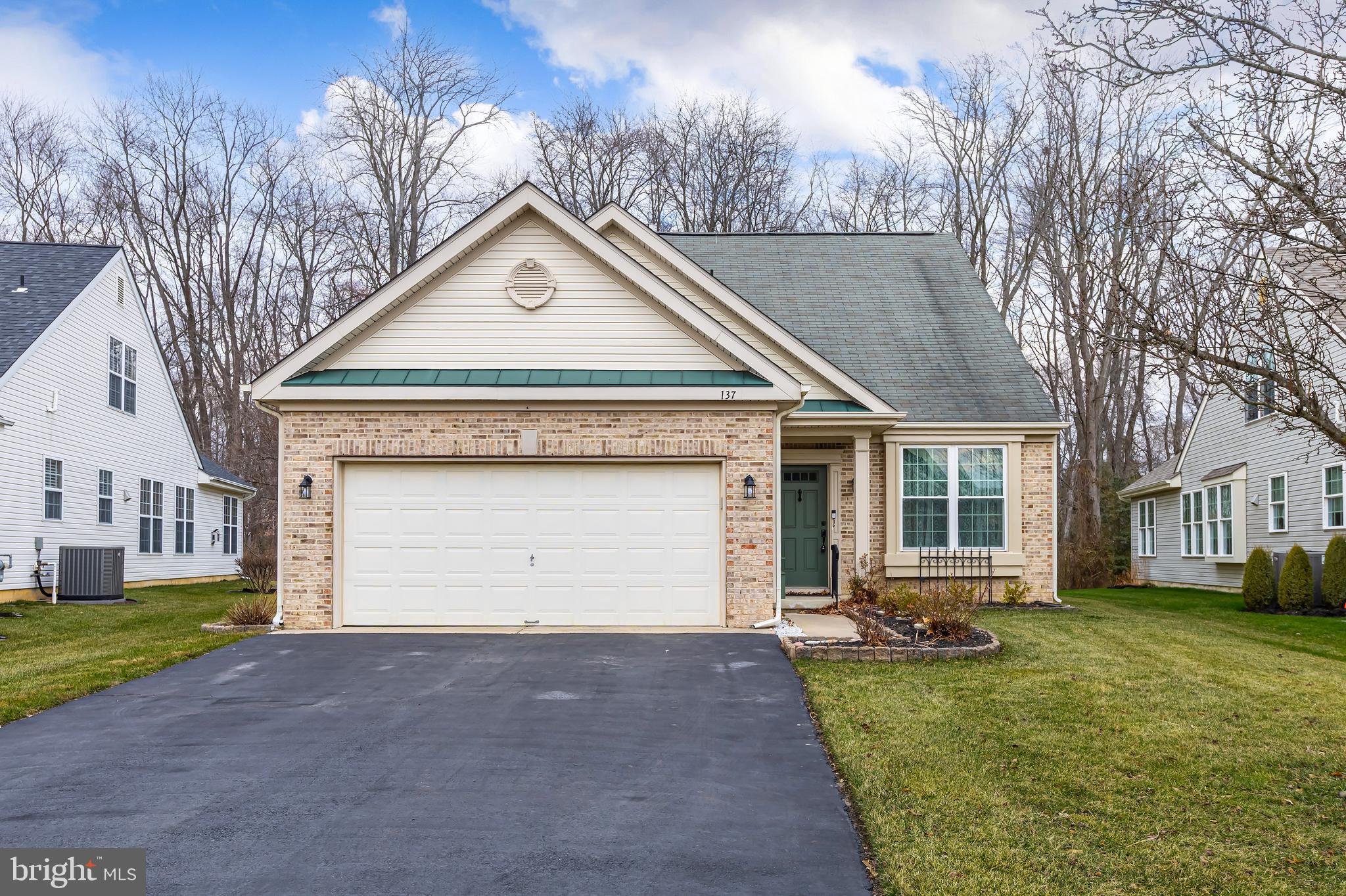 137 Merion Way Hainesport, NJ 08036 - Photo 26 of 26 a front view of a house with a yard and garage