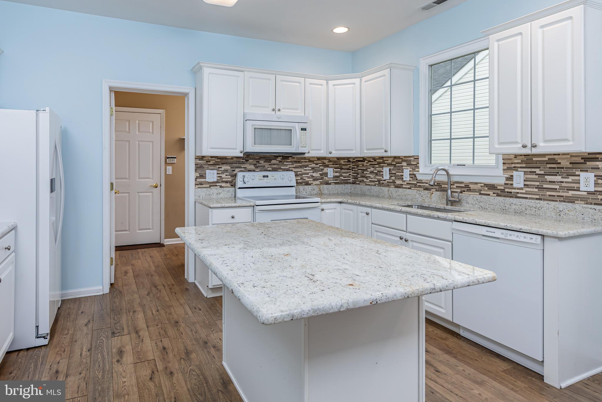 137 Merion Way Hainesport, NJ 08036 - Photo 7 of 26 a kitchen with stainless steel appliances granite countertop a sink stove and refrigerator