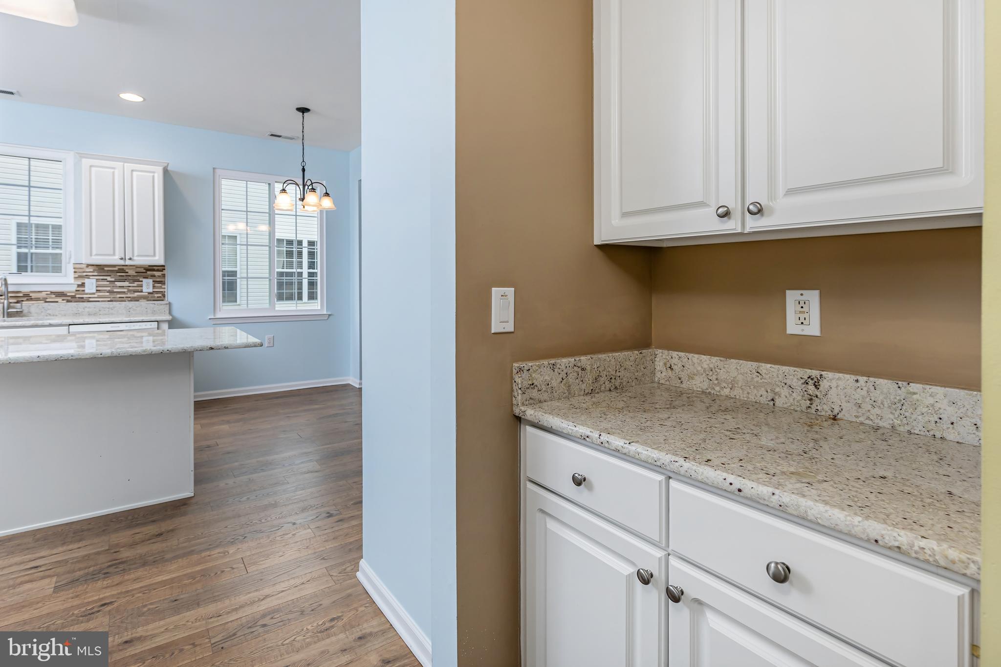 137 Merion Way Hainesport, NJ 08036 - Photo 9 of 26 a kitchen with stainless steel appliances granite countertop a sink and dishwasher with wooden floor
