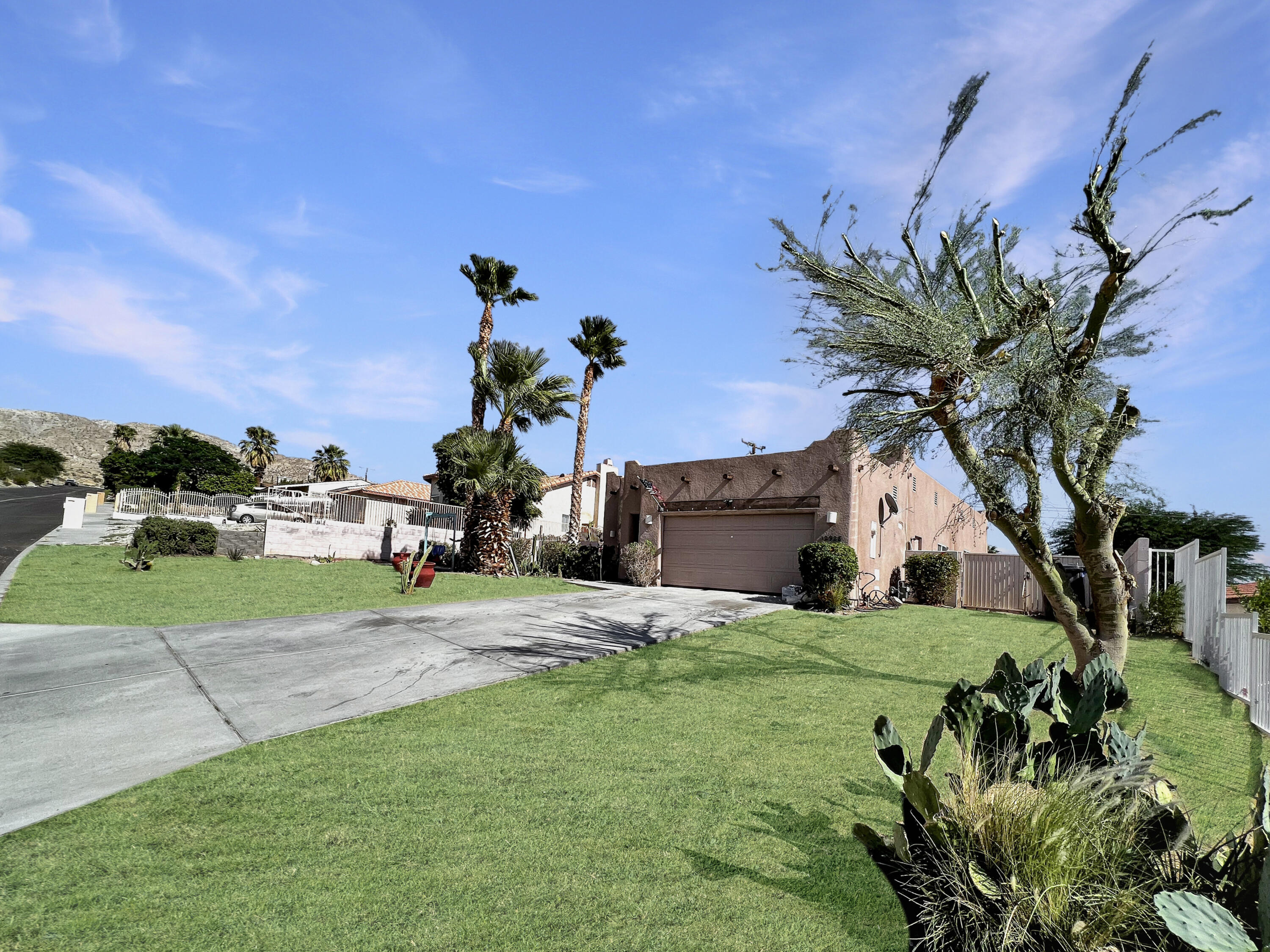 12928 Agua Cayendo Road Desert Hot Springs, CA 92240 - Photo 15 of 21 a view of a house with a yard