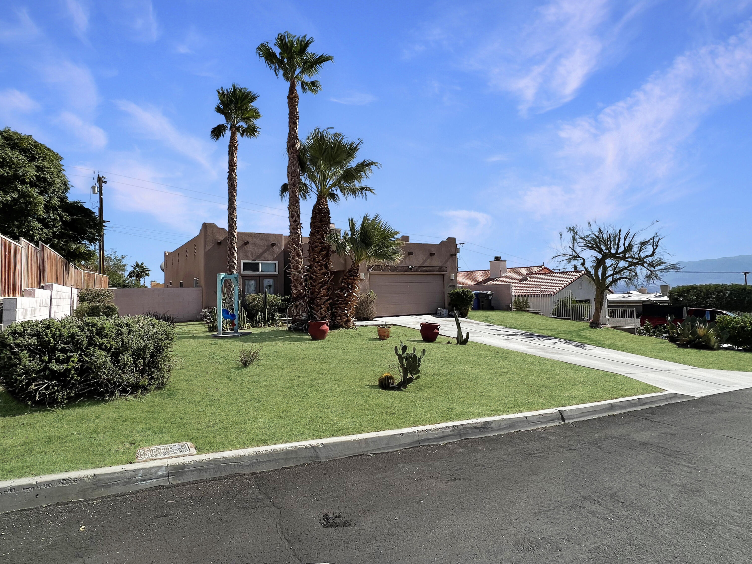 12928 Agua Cayendo Road Desert Hot Springs, CA 92240 - Photo 17 of 21 a house view with a garden space