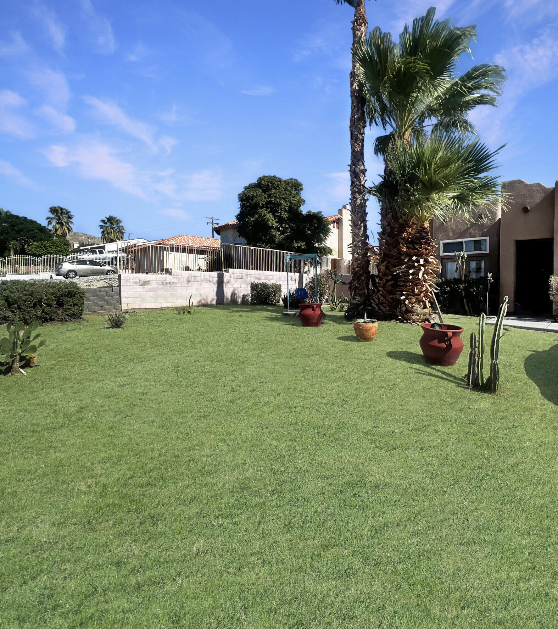 12928 Agua Cayendo Road Desert Hot Springs, CA 92240 - Photo 19 of 21 a view of a house with backyard and sitting area