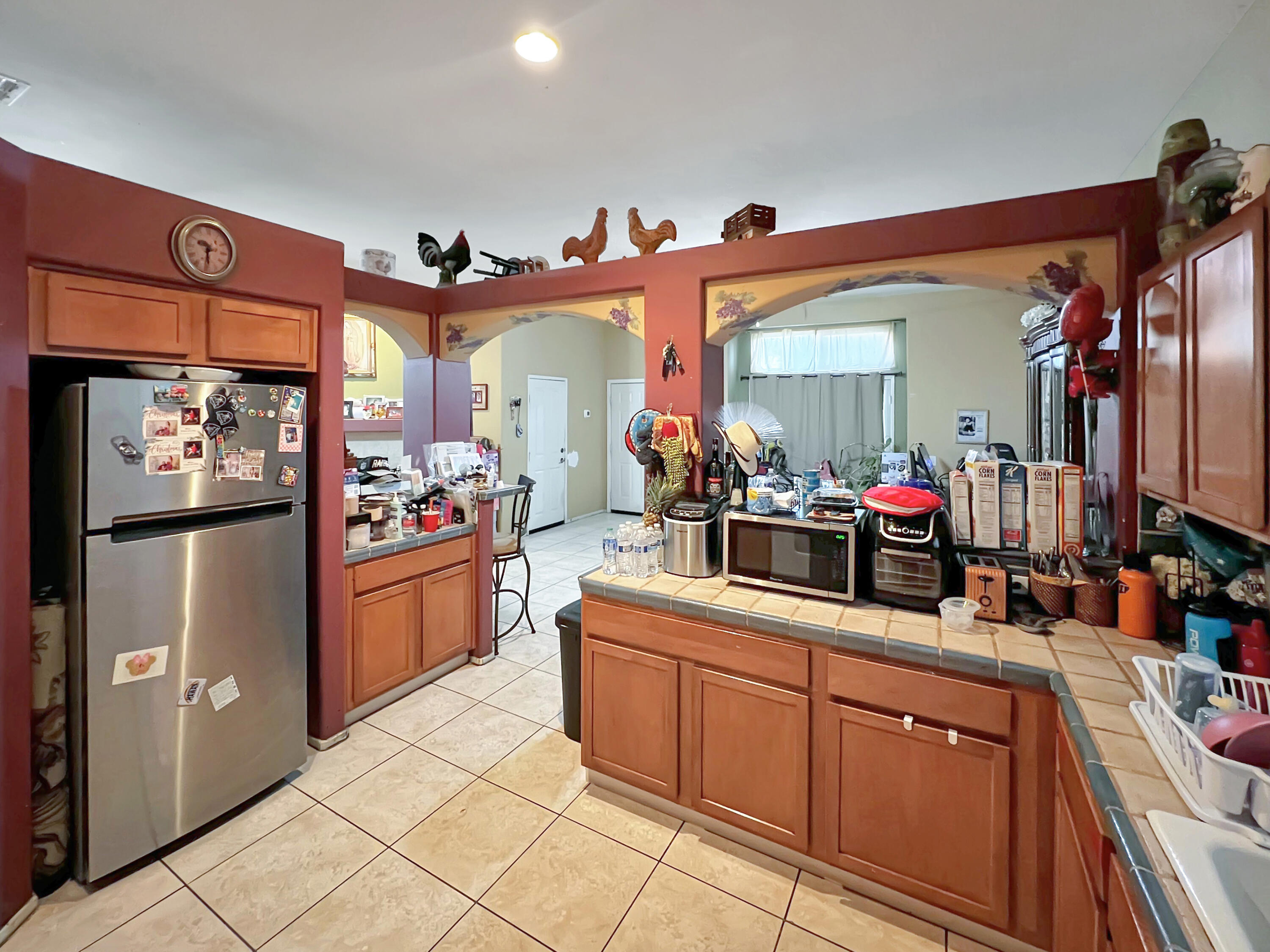 12928 Agua Cayendo Road Desert Hot Springs, CA 92240 - Photo 6 of 21 a kitchen with granite countertop a sink and cabinets