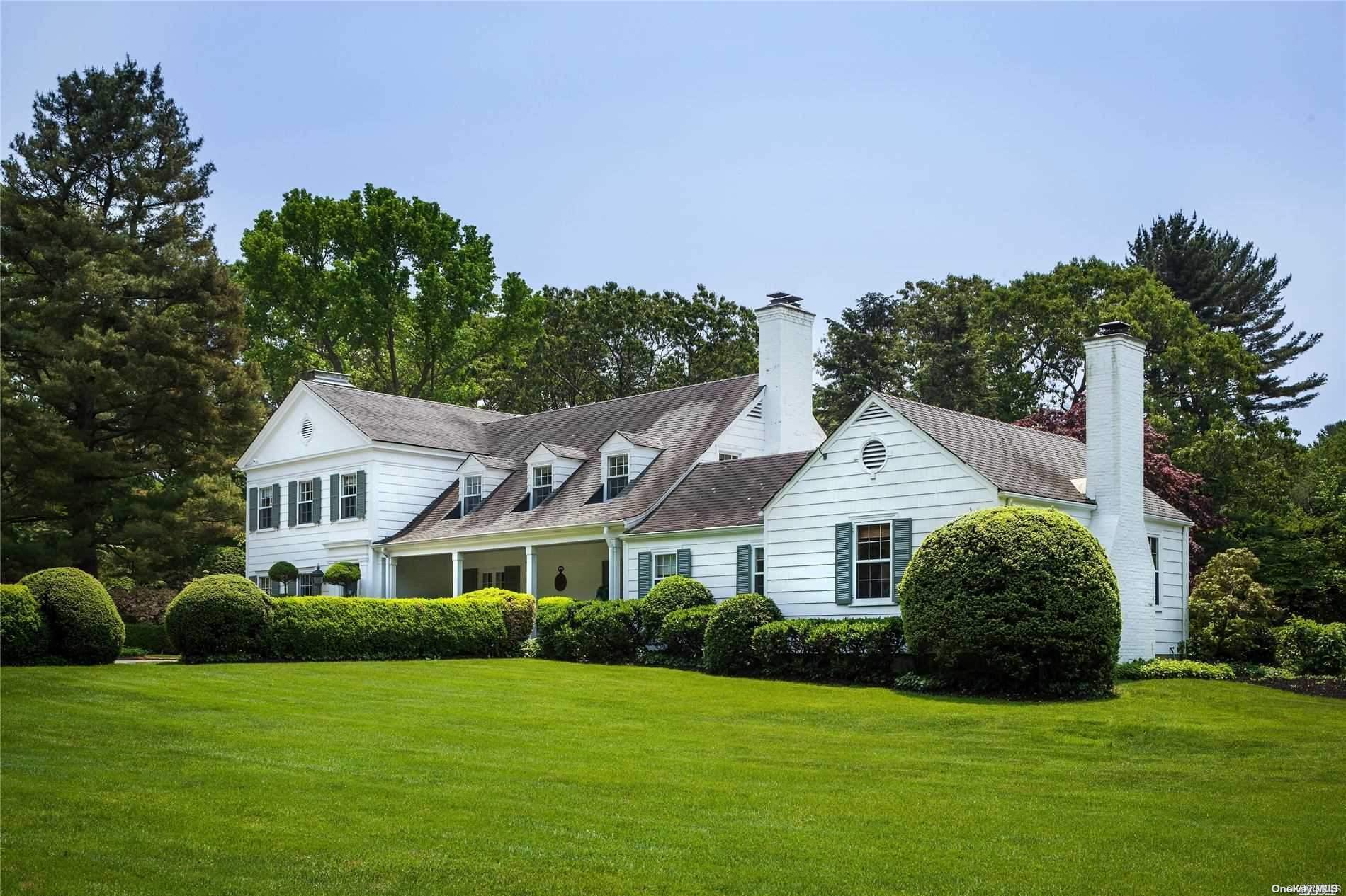 37 Piping Rock Road Locust Valley, NY 11560 - Photo 1 of 1 a front view of a house with a yard