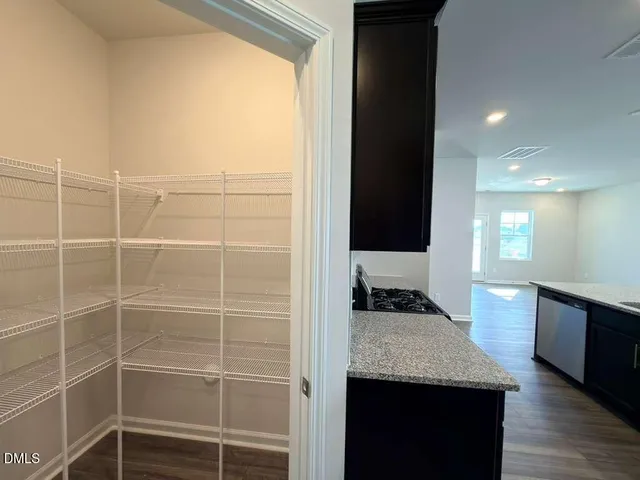 a view of a kitchen with a sink and a window