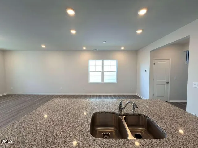 a kitchen with sink and window