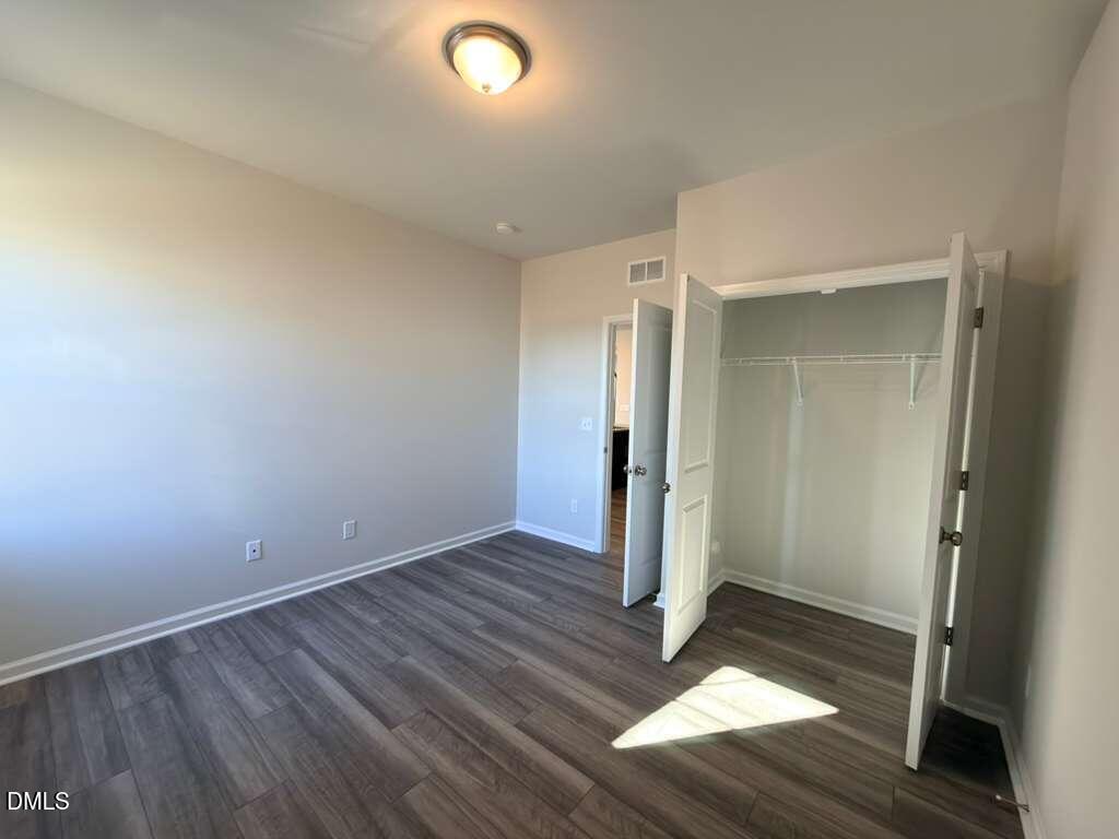 2007 English Saddle Lane Durham, NC 27703 - Photo 19 of 45 an empty room with wooden floor and entrance