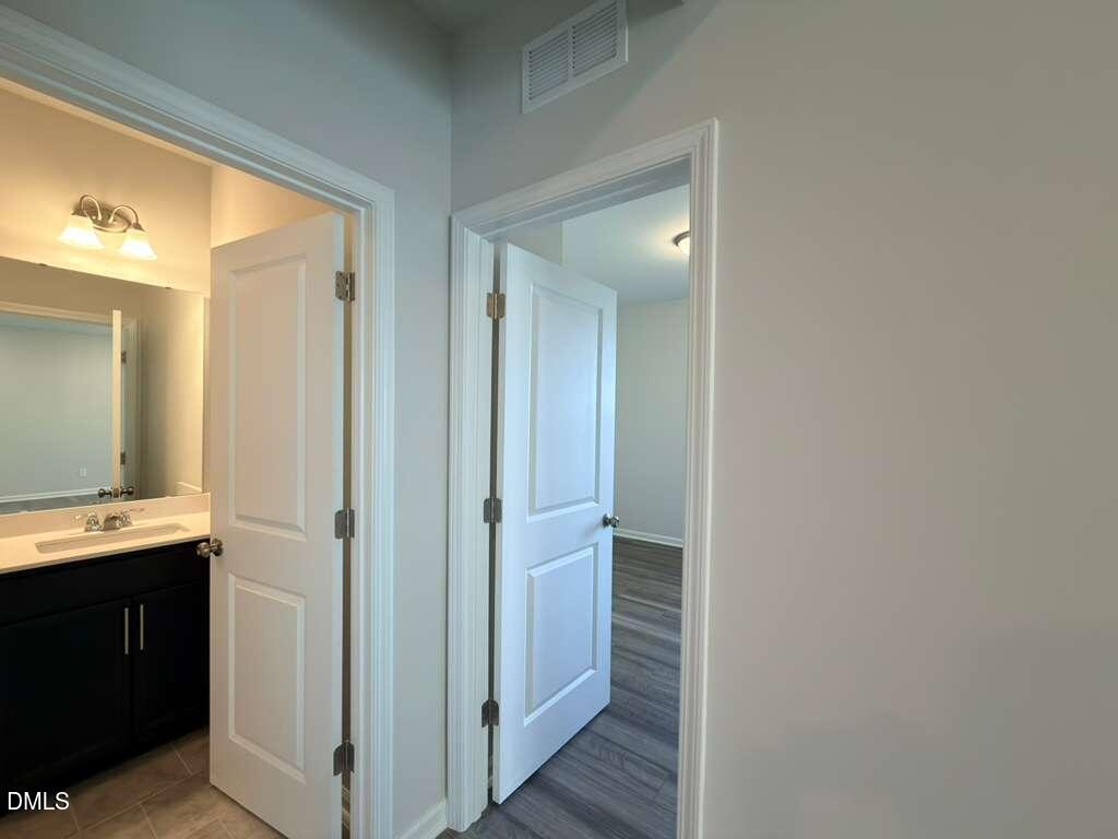 2007 English Saddle Lane Durham, NC 27703 - Photo 20 of 45 a view of a bathroom from a hallway