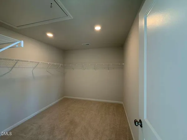 an empty room with a bathroom