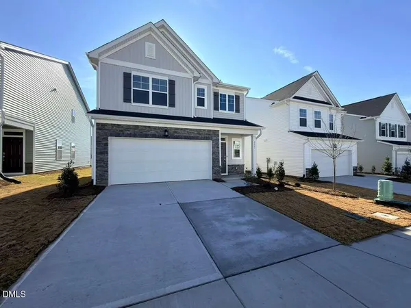 a front view of a house with yard