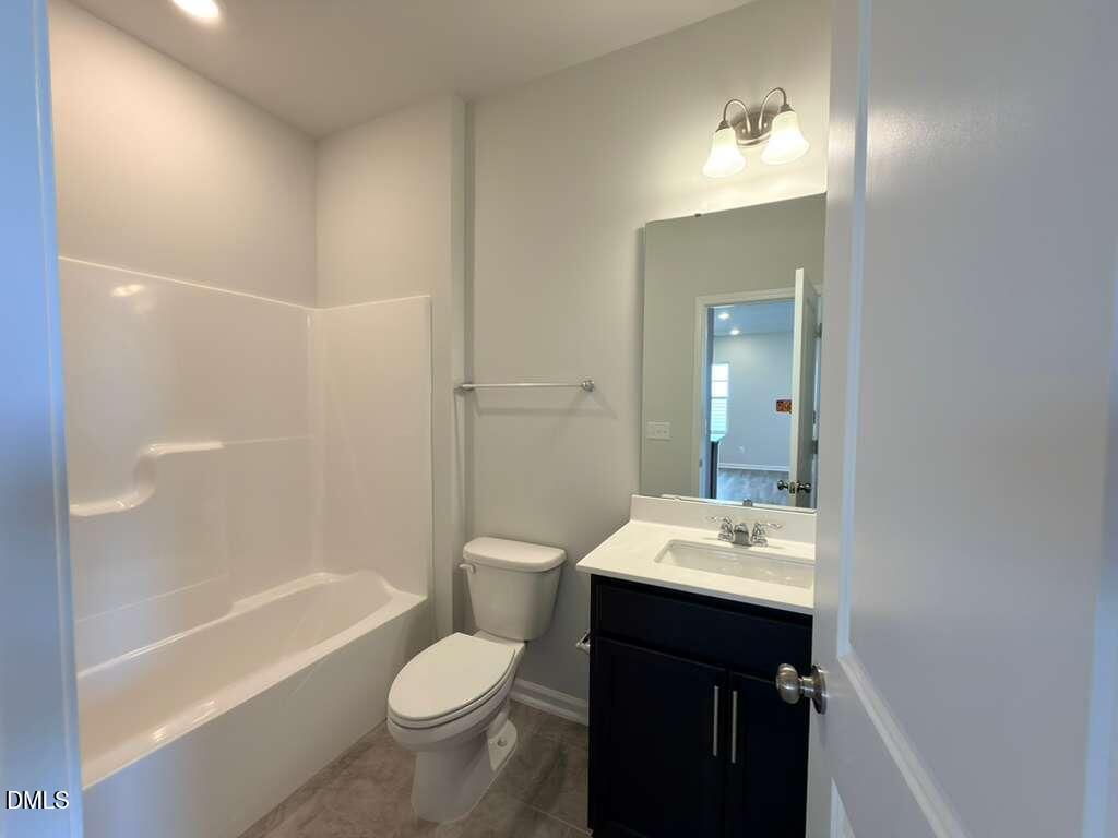 2007 English Saddle Lane Durham, NC 27703 - Photo 21 of 45 a bathroom with a sink a toilet and shower