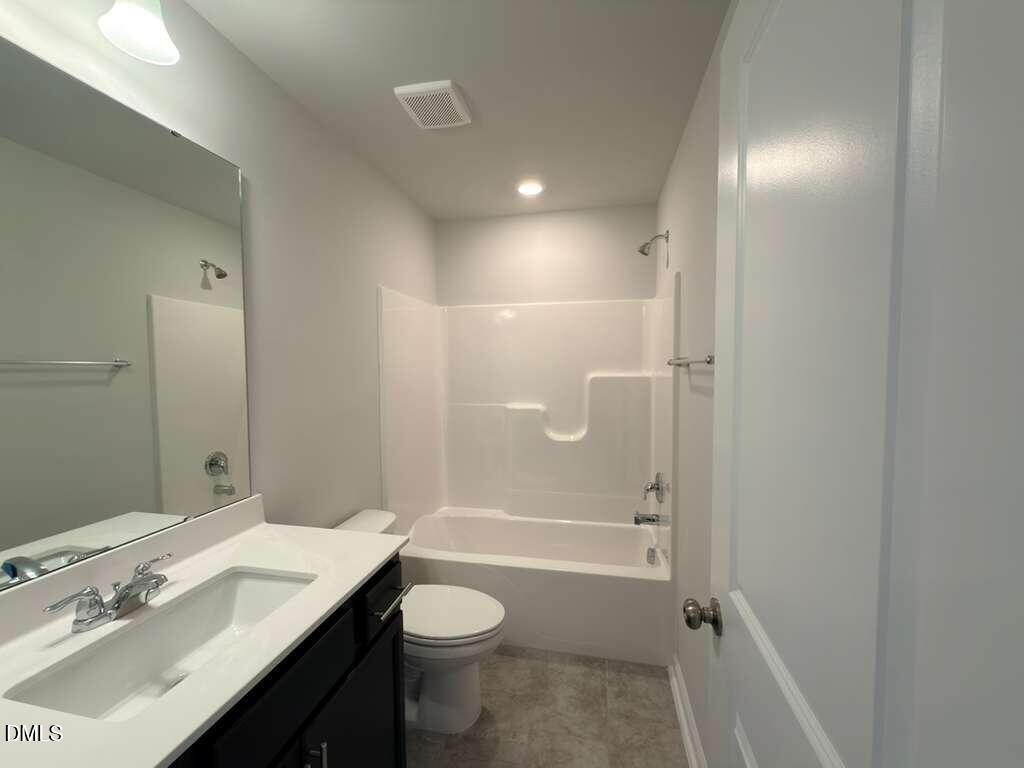 2007 English Saddle Lane Durham, NC 27703 - Photo 32 of 45 a bathroom with a sink a toilet and shower