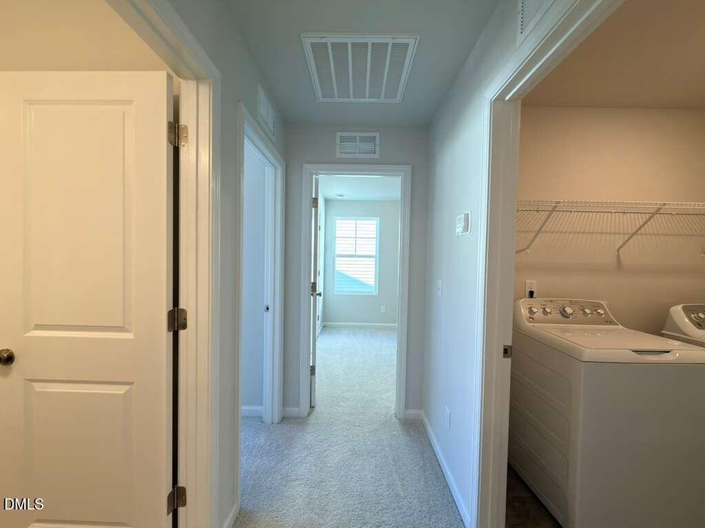 2007 English Saddle Lane Durham, NC 27703 - Photo 33 of 45 a view of a hallway with closet and utility room