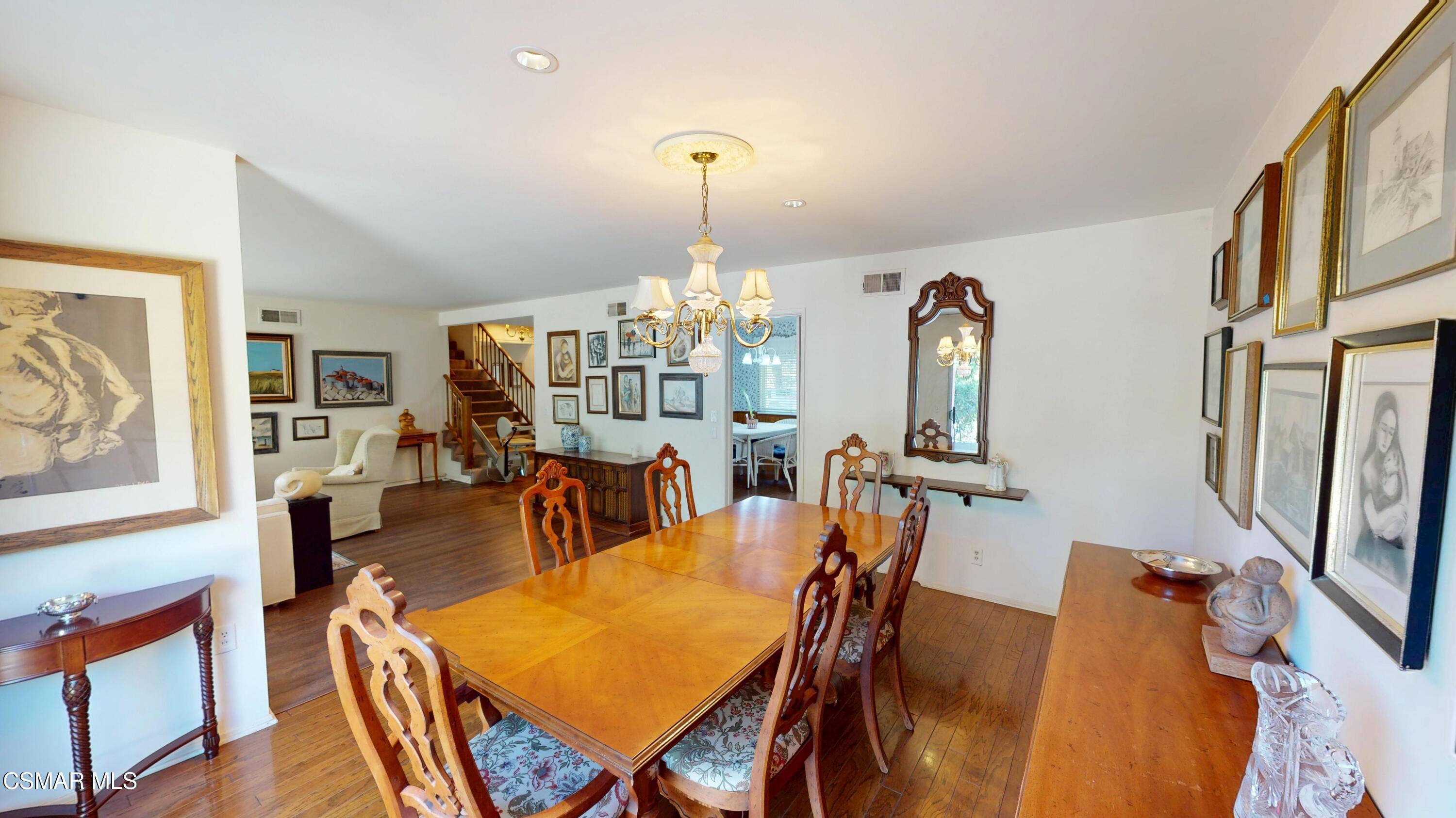 10900 Des Moines Avenue Porter Ranch, CA 91326 - Photo 11 of 38 a view of a dining room with furniture and chandelier