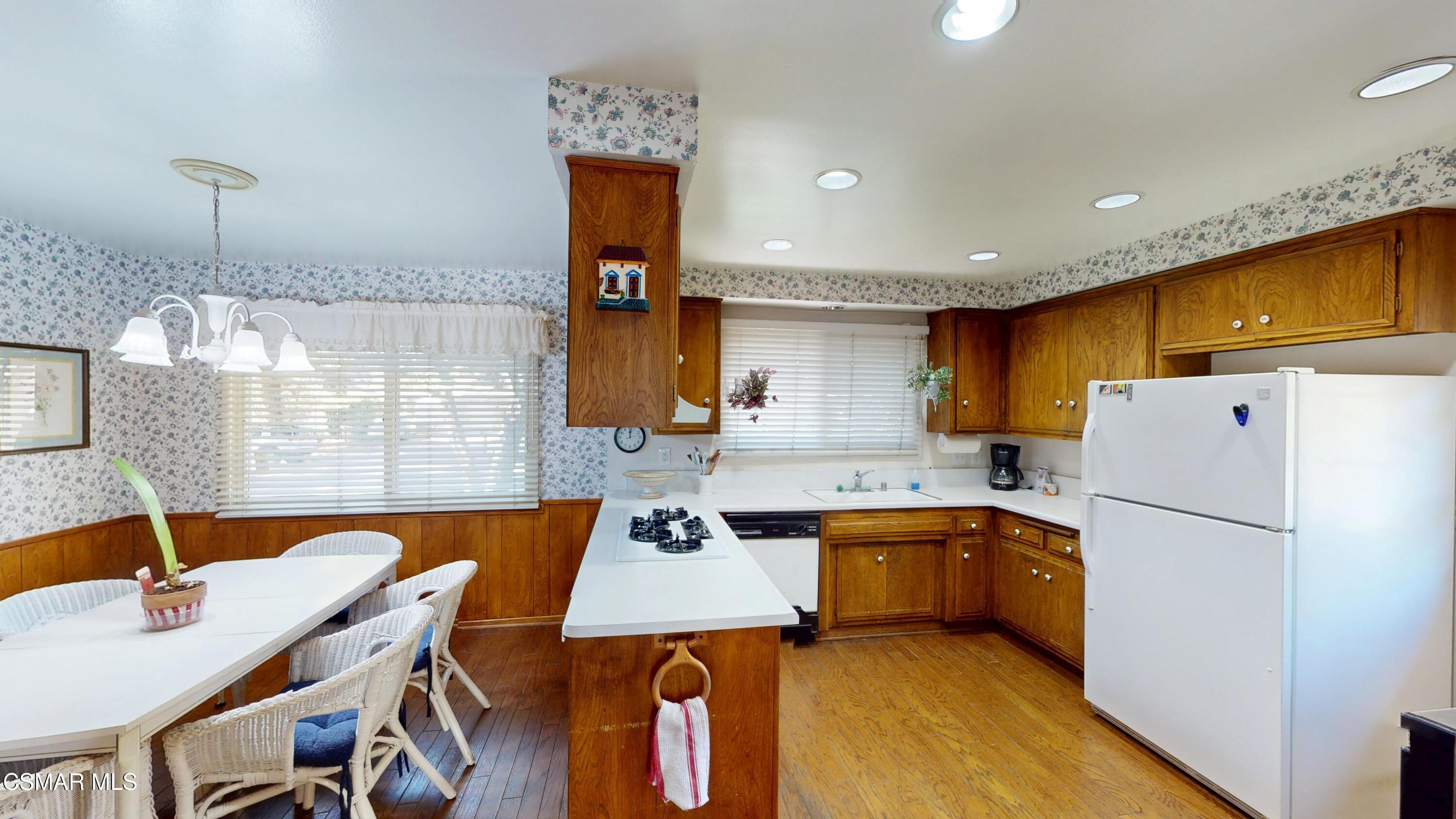 10900 Des Moines Avenue Porter Ranch, CA 91326 - Photo 12 of 38 a kitchen with a sink refrigerator and cabinets