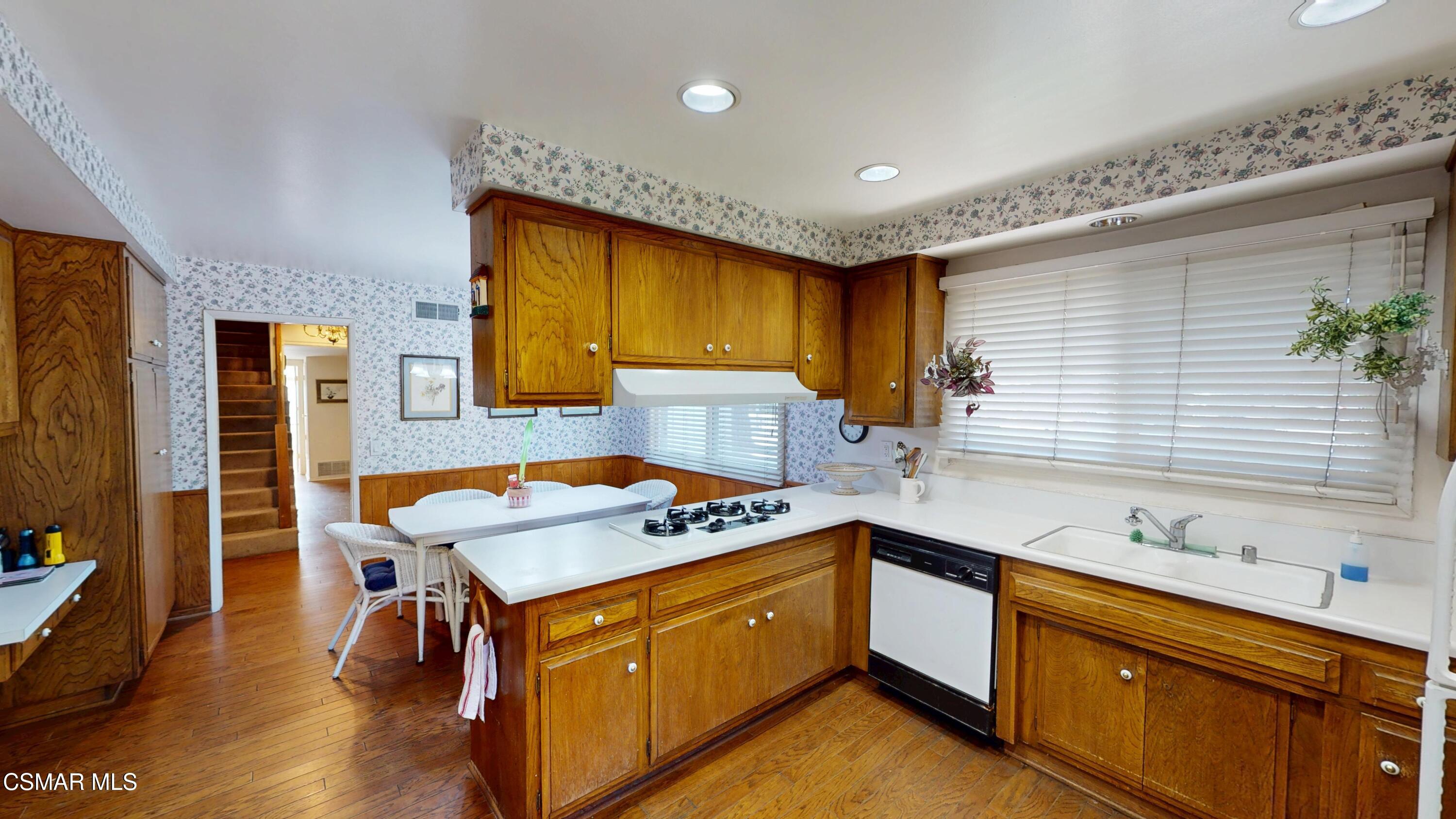 10900 Des Moines Avenue Porter Ranch, CA 91326 - Photo 13 of 38 a kitchen with a sink stove and cabinets