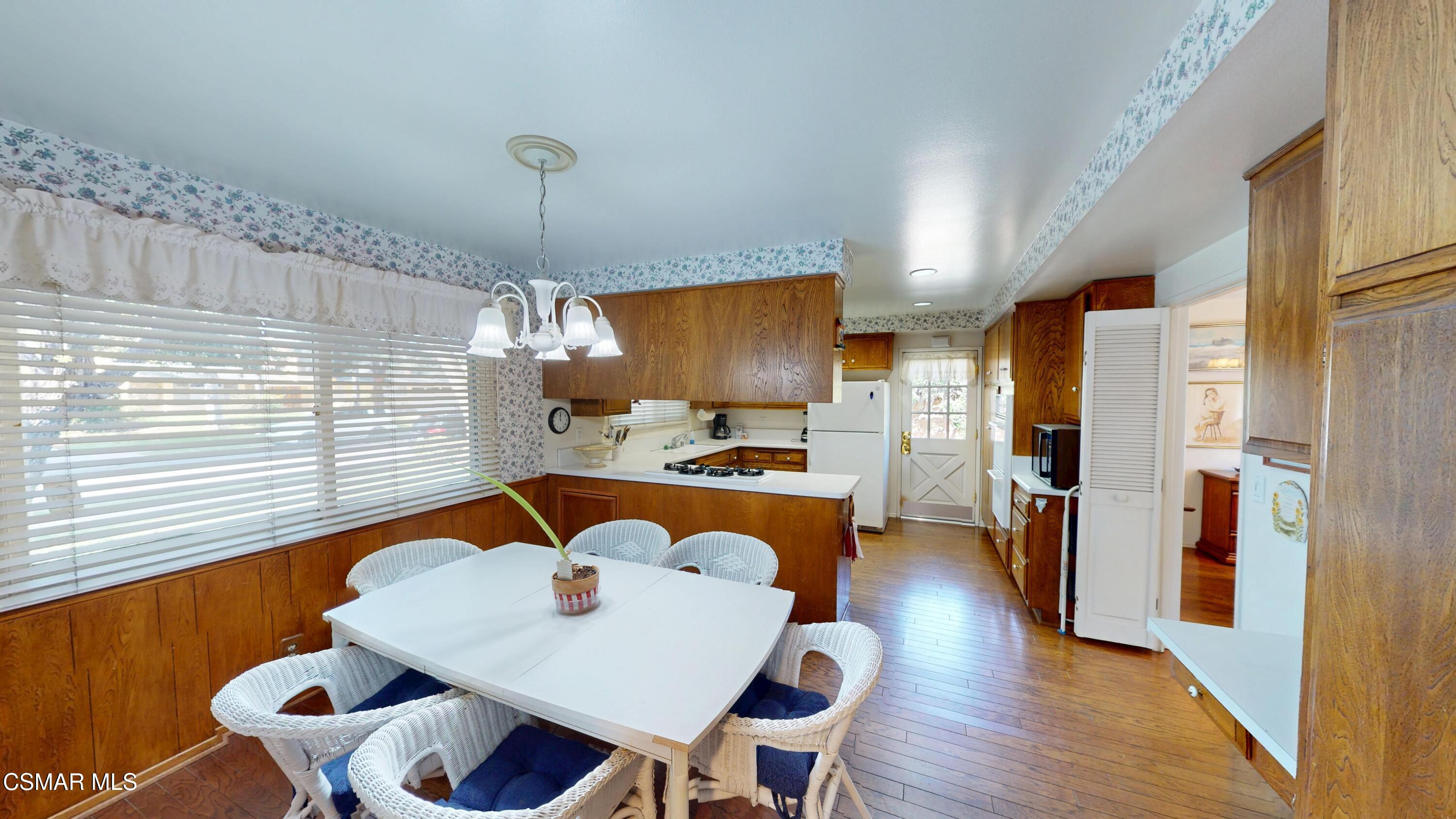 10900 Des Moines Avenue Porter Ranch, CA 91326 - Photo 16 of 38 a dining room with furniture and window