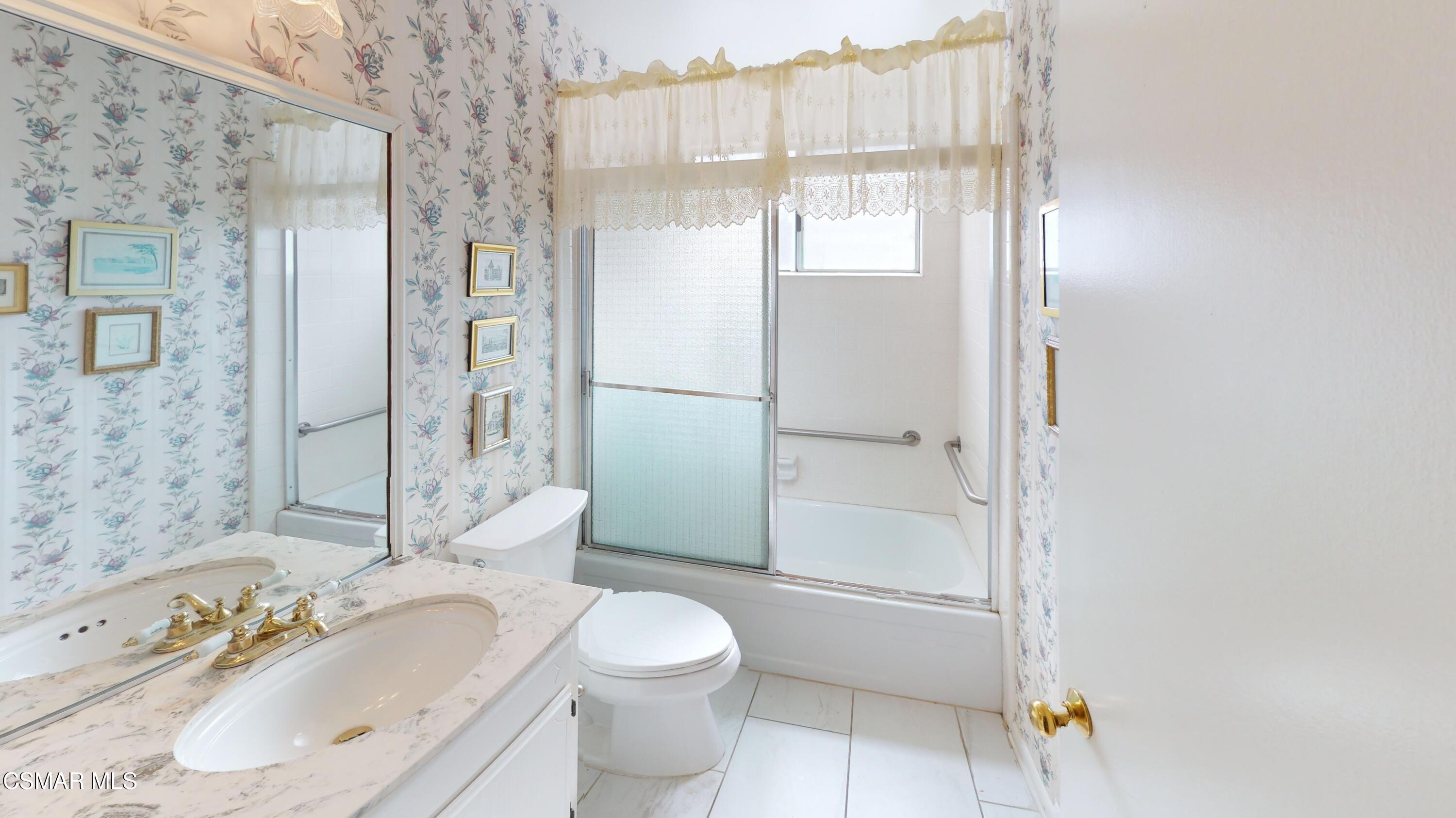 10900 Des Moines Avenue Porter Ranch, CA 91326 - Photo 20 of 38 a bathroom with a sink toilet and shower