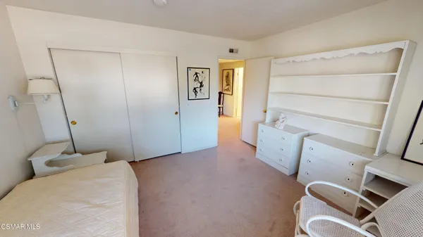 a bed room with a bed and a window