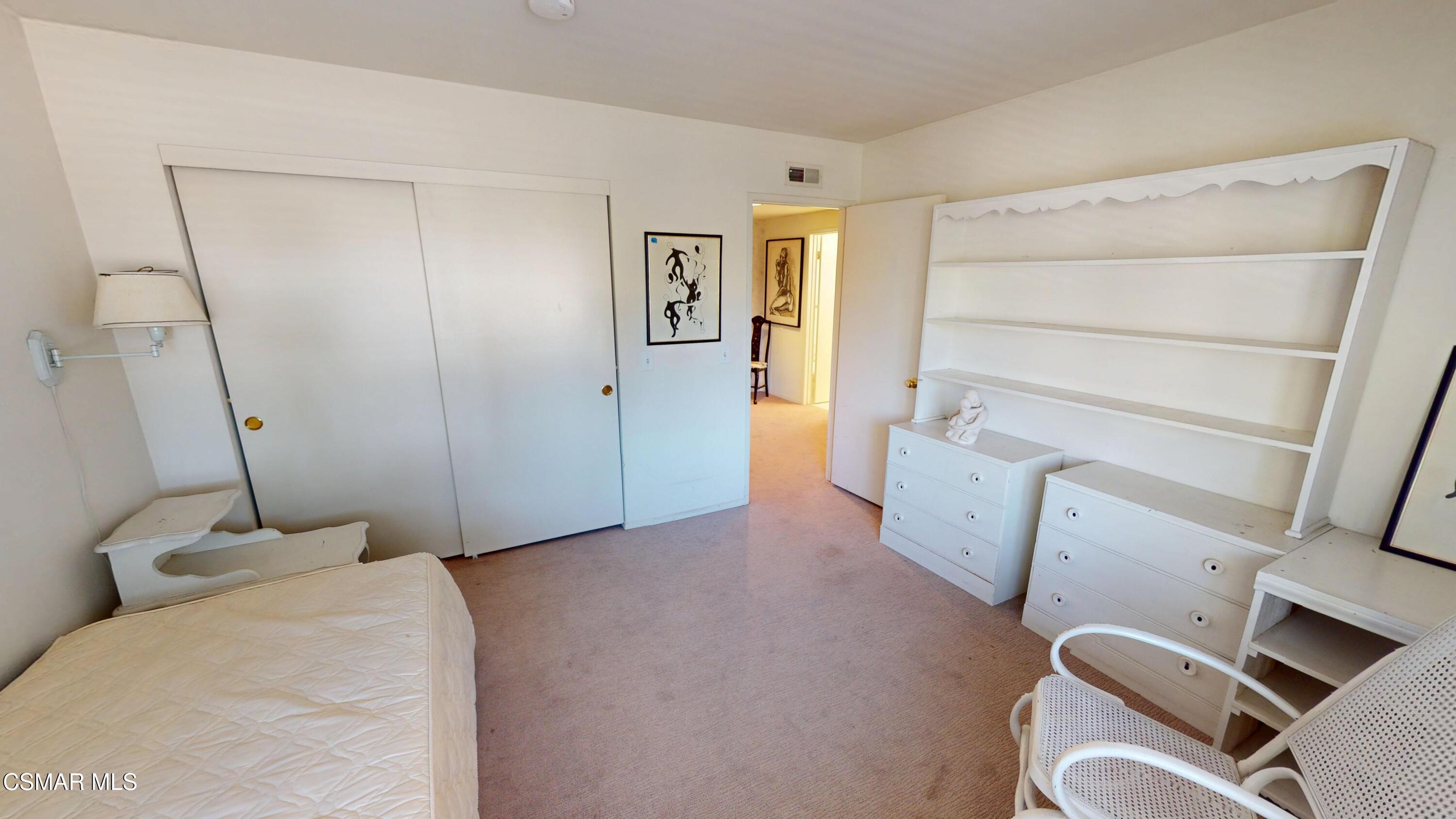 10900 Des Moines Avenue Porter Ranch, CA 91326 - Photo 24 of 38 a bed room with a bed and a window