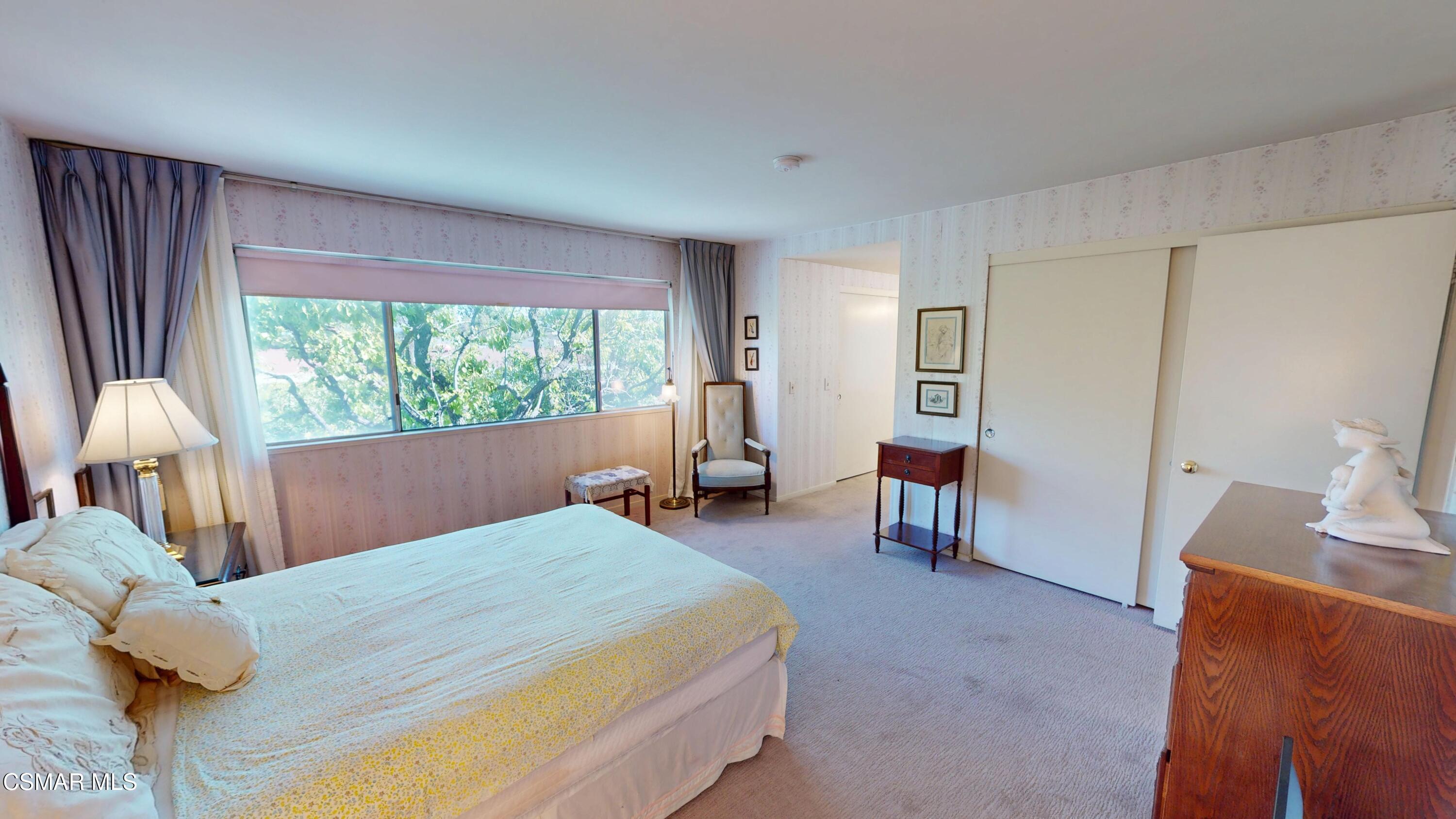 10900 Des Moines Avenue Porter Ranch, CA 91326 - Photo 27 of 38 a bed room with a bed and a chair