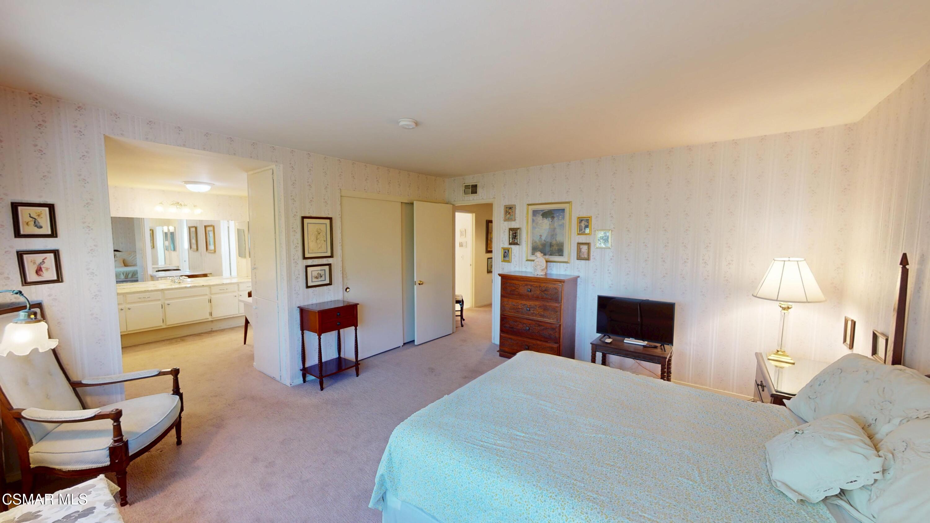 10900 Des Moines Avenue Porter Ranch, CA 91326 - Photo 28 of 38 a bedroom with a bed and furniture