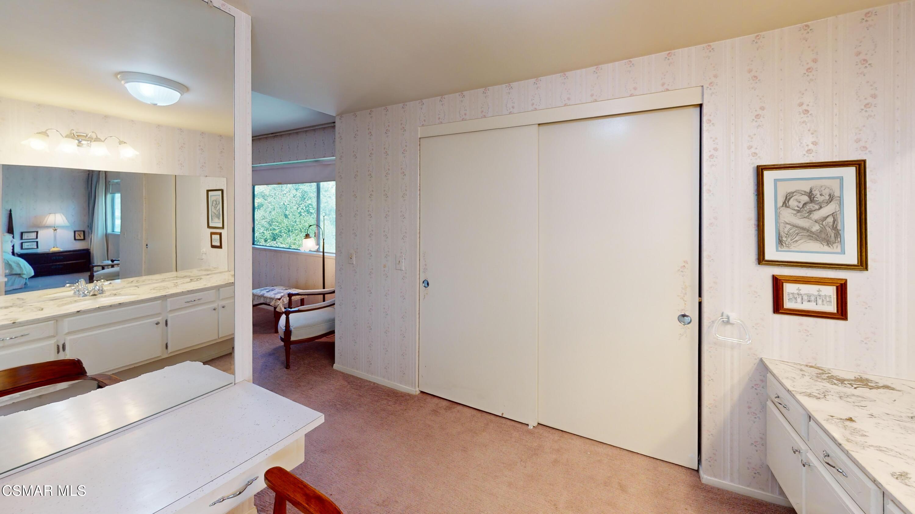 10900 Des Moines Avenue Porter Ranch, CA 91326 - Photo 30 of 38 a room with a bed and a table