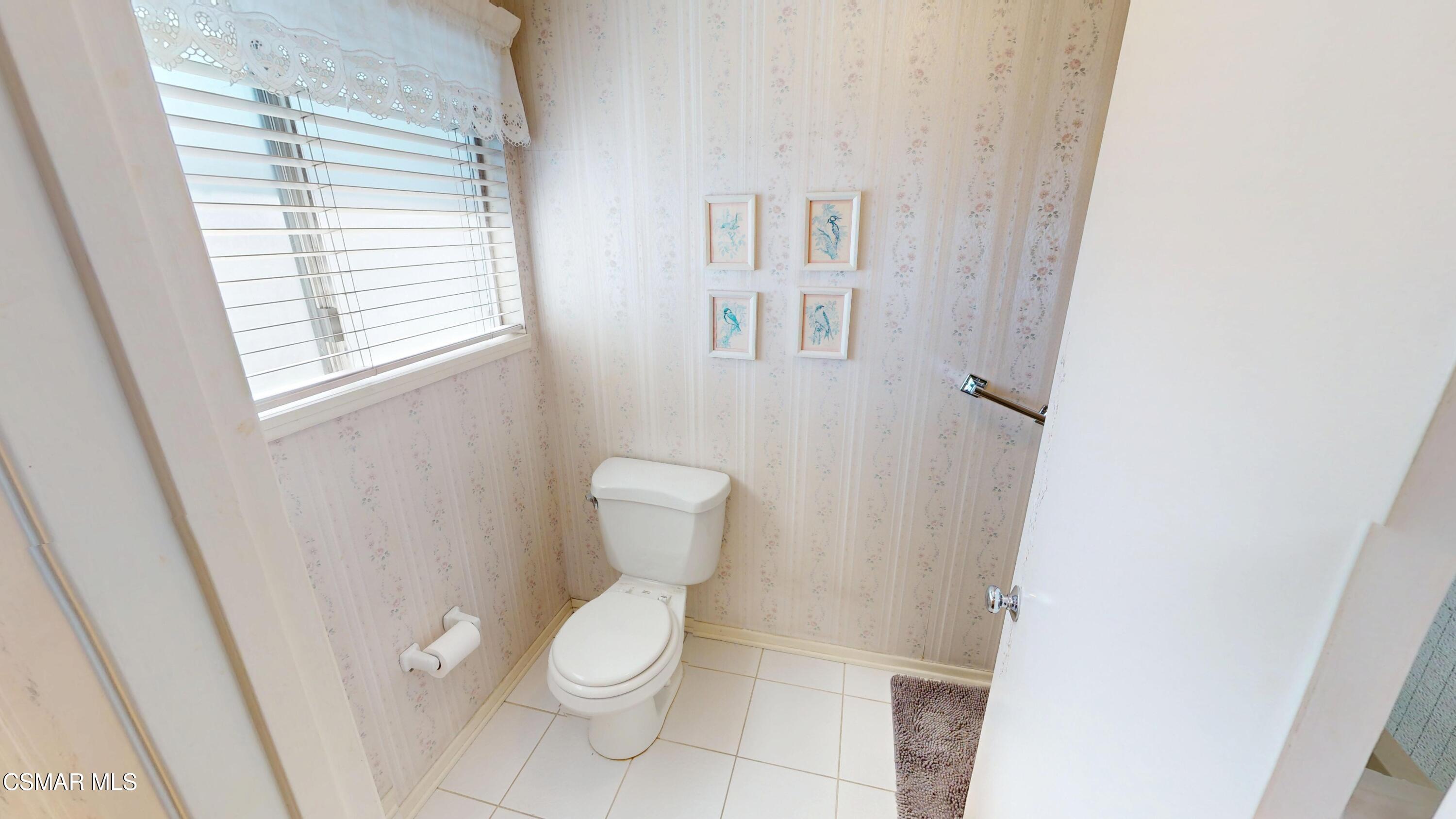 10900 Des Moines Avenue Porter Ranch, CA 91326 - Photo 31 of 38 a white toilet sitting next to a window