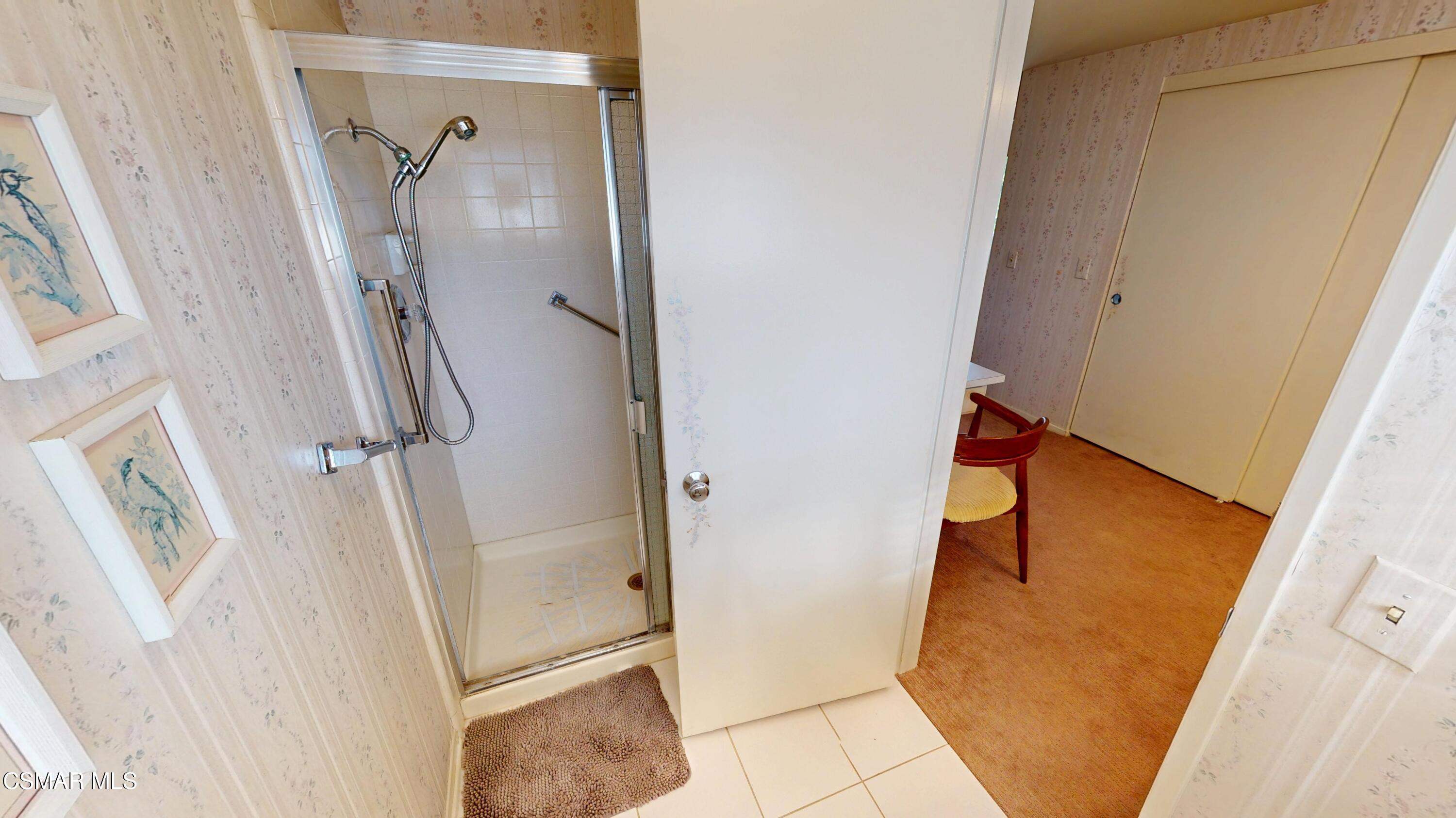 10900 Des Moines Avenue Porter Ranch, CA 91326 - Photo 32 of 38 a bathroom with a tub and a shower