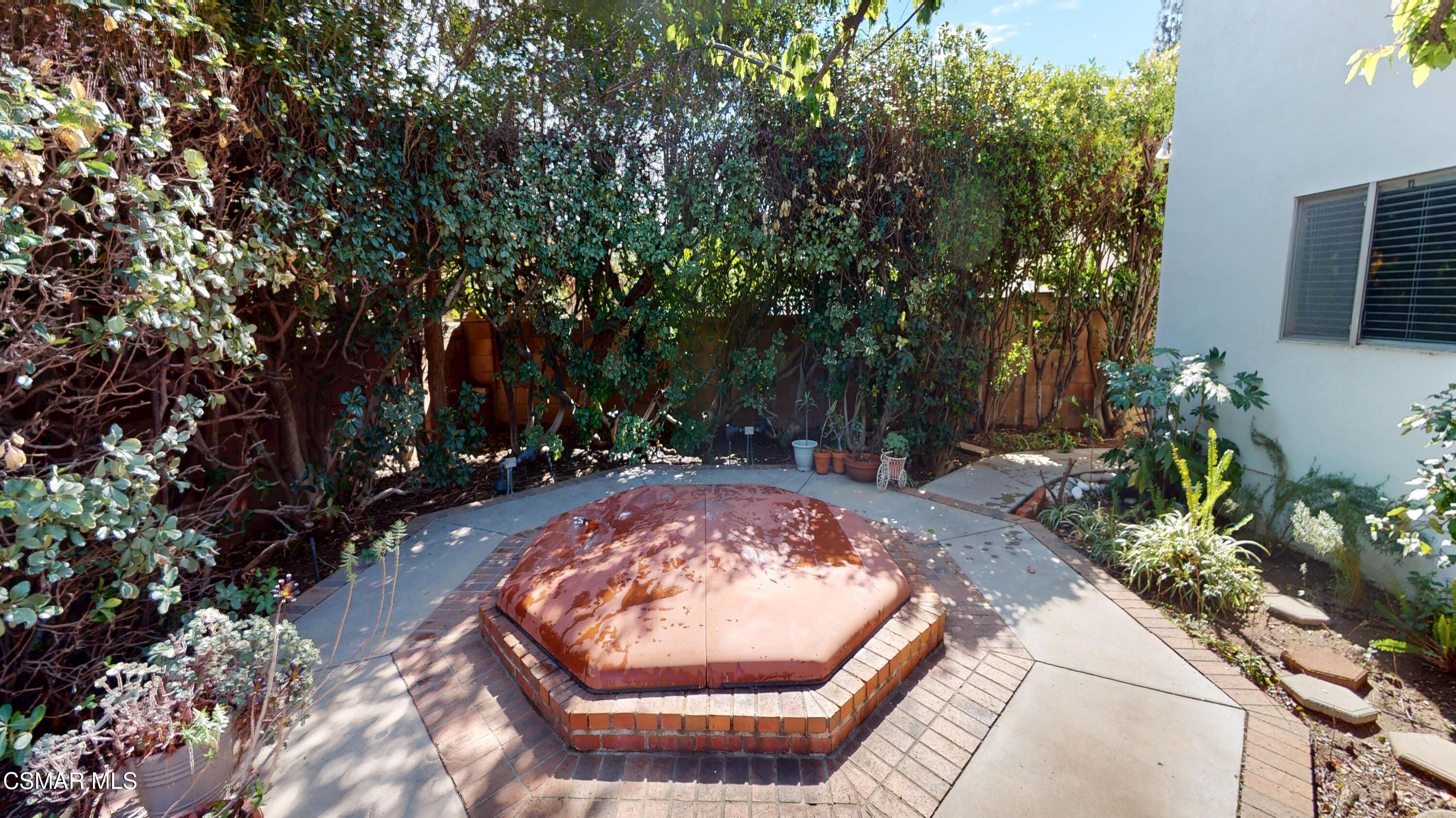 10900 Des Moines Avenue Porter Ranch, CA 91326 - Photo 36 of 38 a view of a backyard of a house