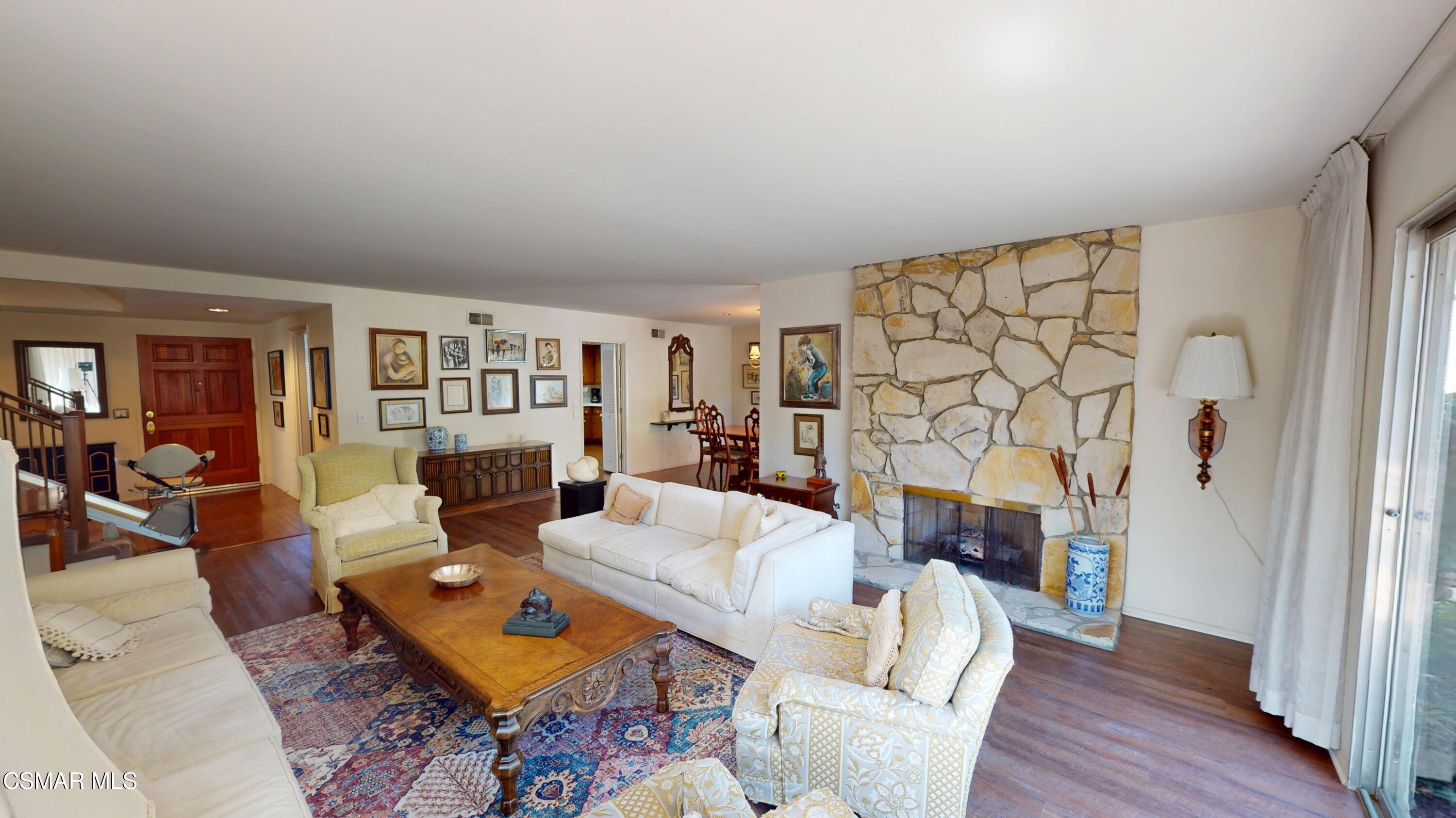 10900 Des Moines Avenue Porter Ranch, CA 91326 - Photo 8 of 38 a living room with furniture and wooden floor