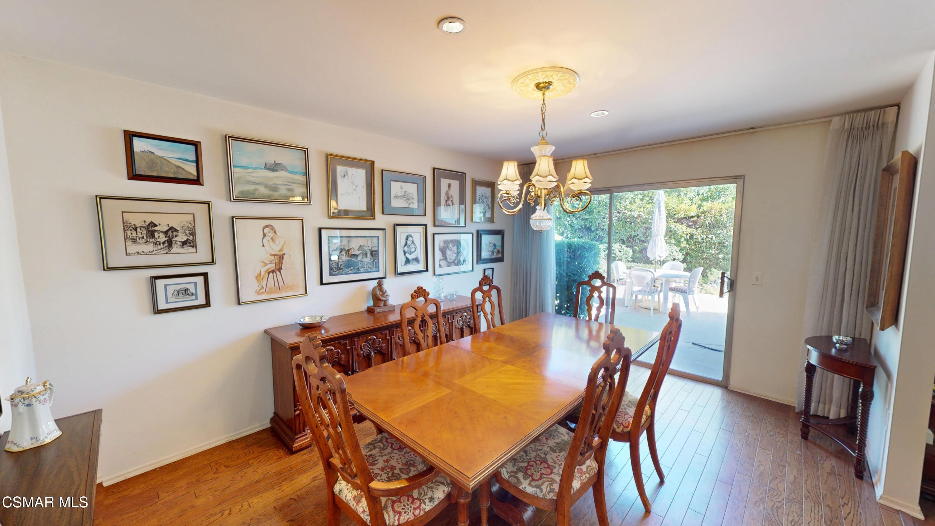 10900 Des Moines Avenue Porter Ranch, CA 91326 - Photo 9 of 38 a view of a dining room with furniture window and wooden floor
