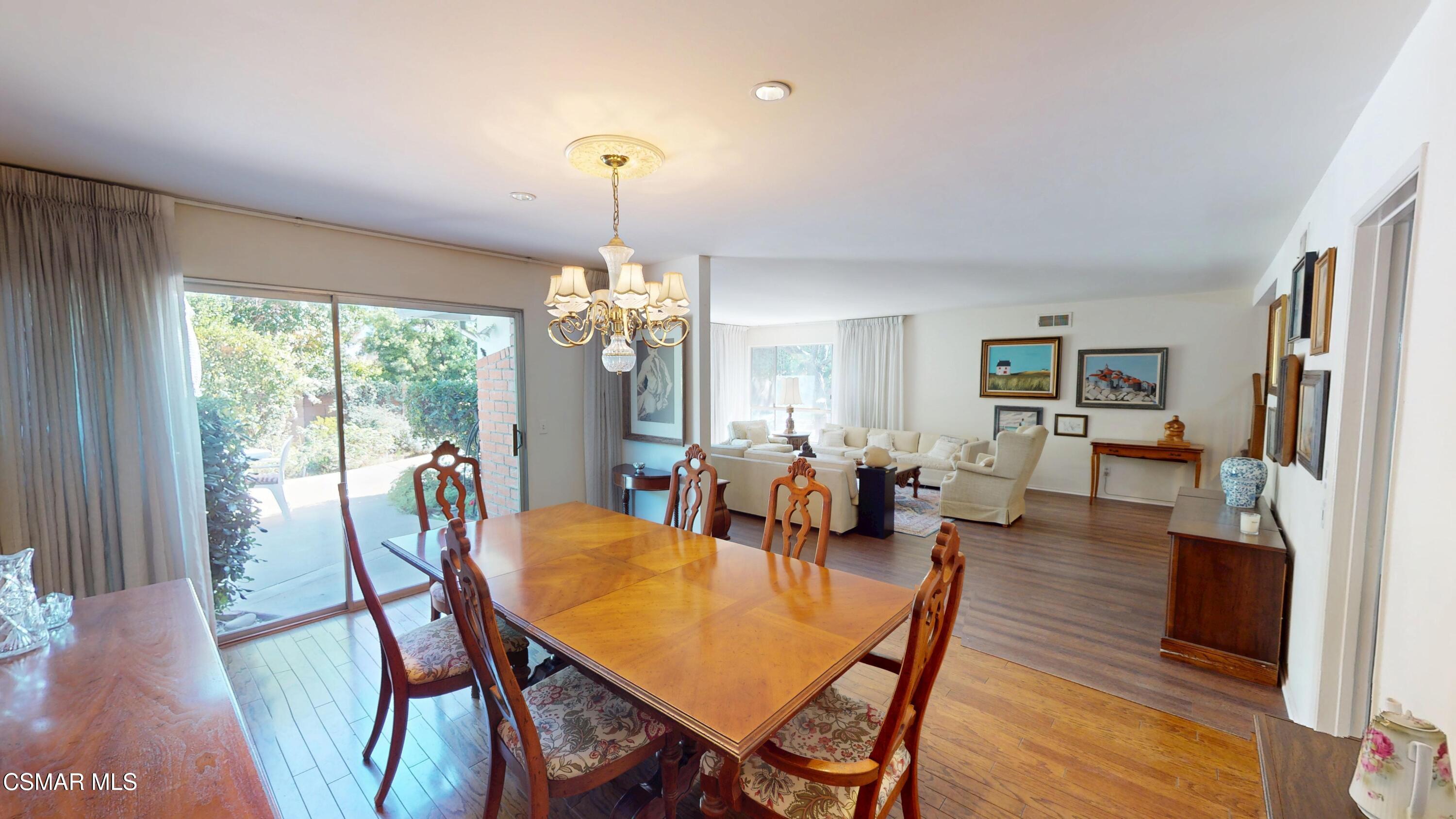 10900 Des Moines Avenue Porter Ranch, CA 91326 - Photo 10 of 38 a view of a dining room with furniture window and wooden floor