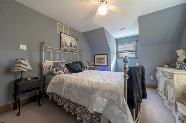 a bed room with a bed and a lamp