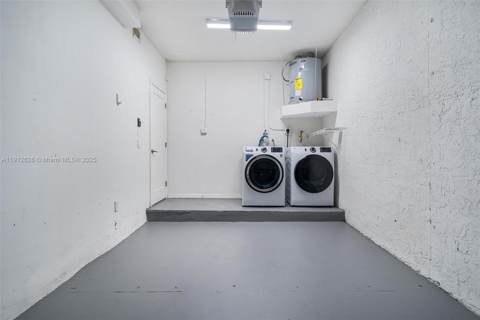 8658 Southwest 159th Court Miami, FL 33193 - Photo 11 of 30 a utility room with dryer and washer