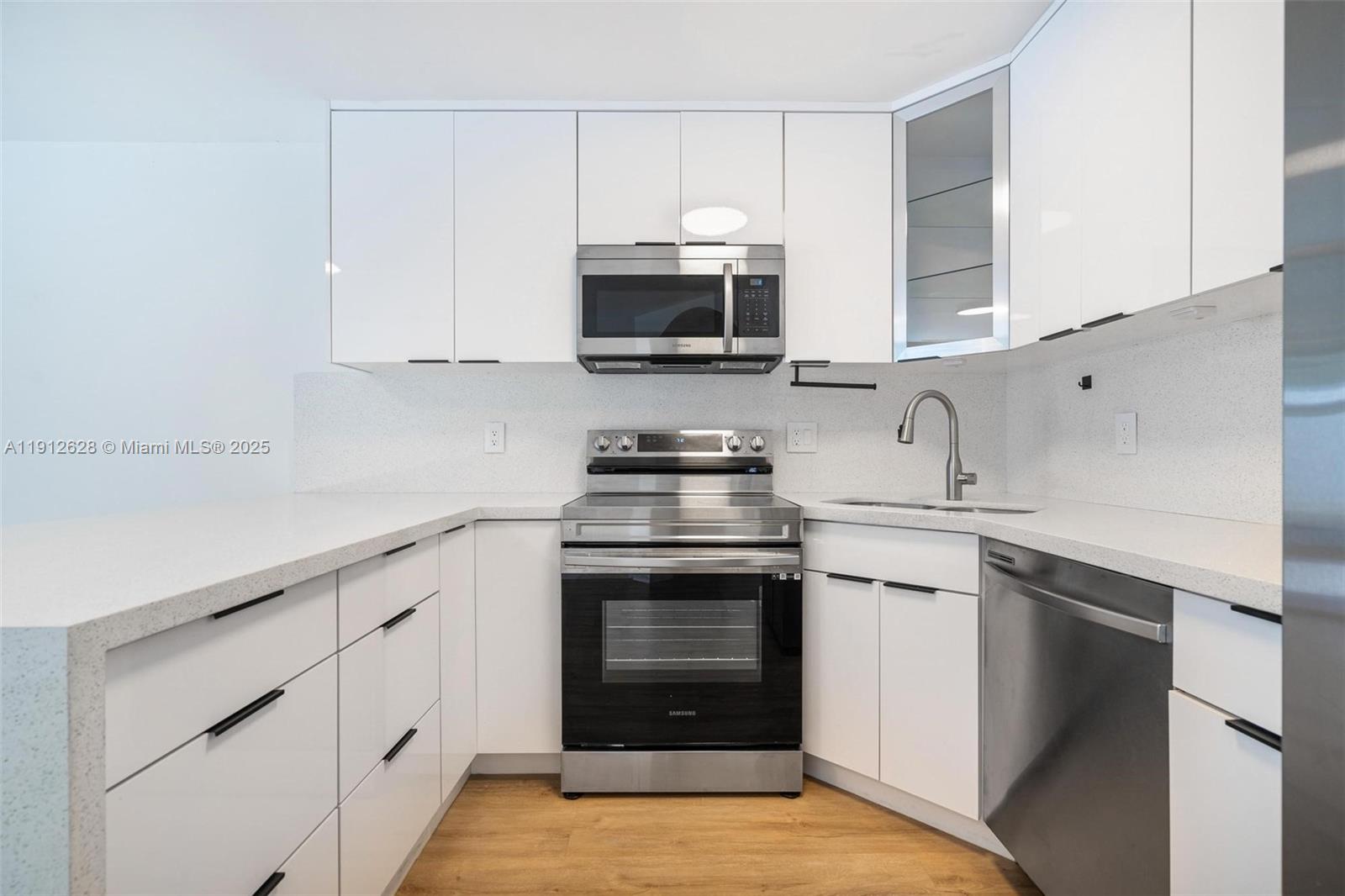 8658 Southwest 159th Court Miami, FL 33193 - Photo 13 of 30 a kitchen with cabinets stainless steel appliances and a sink