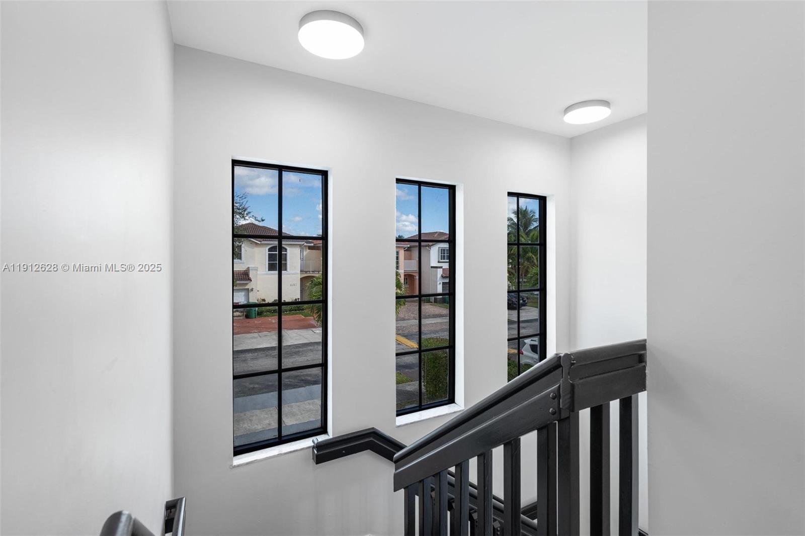 8658 Southwest 159th Court Miami, FL 33193 - Photo 18 of 30 a view of a hallway with window