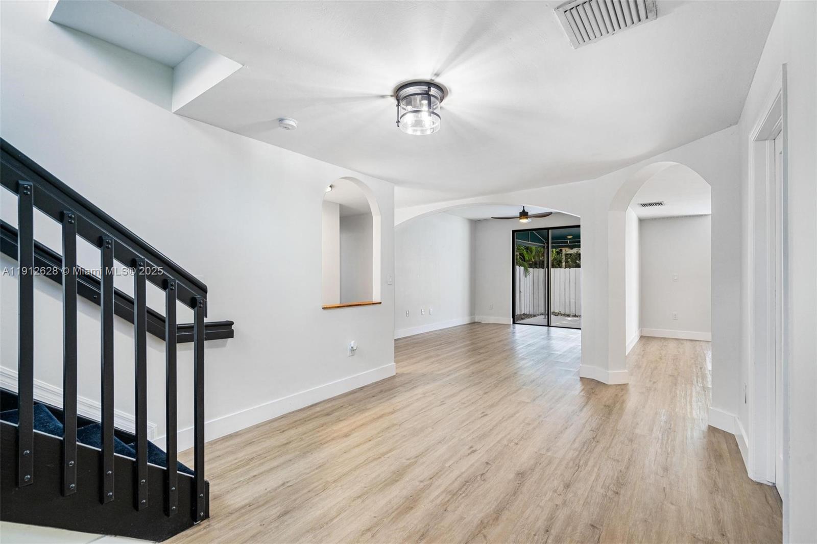 8658 Southwest 159th Court Miami, FL 33193 - Photo 5 of 30 a view of an entryway with wooden floor