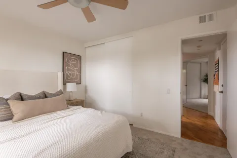 a bedroom with a bed and a view of bathroom