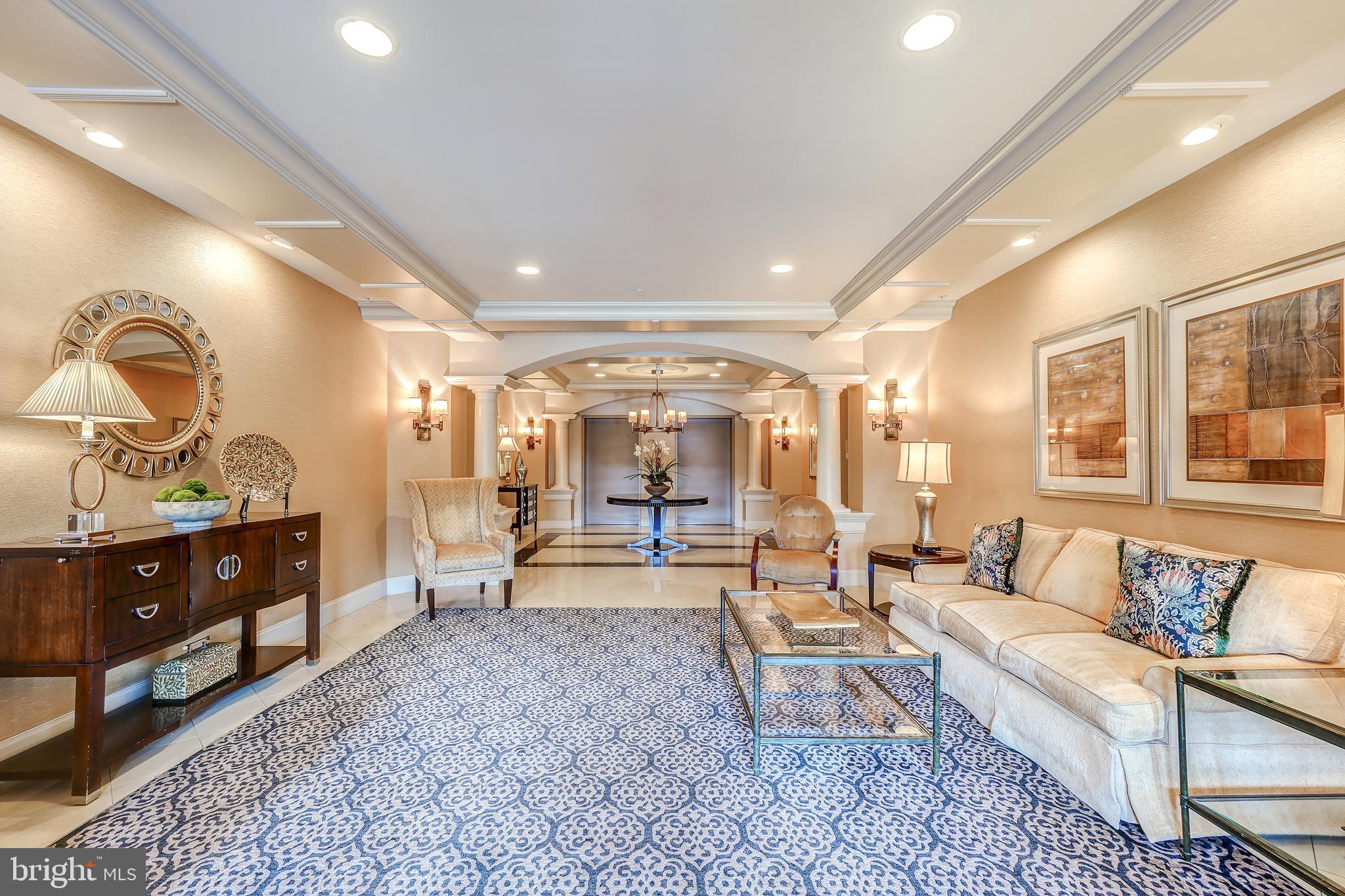 3030 Mill Island Parkway, Unit 109 Frederick, MD 21701 - Photo 2 of 20 a living room with furniture and a wooden floor