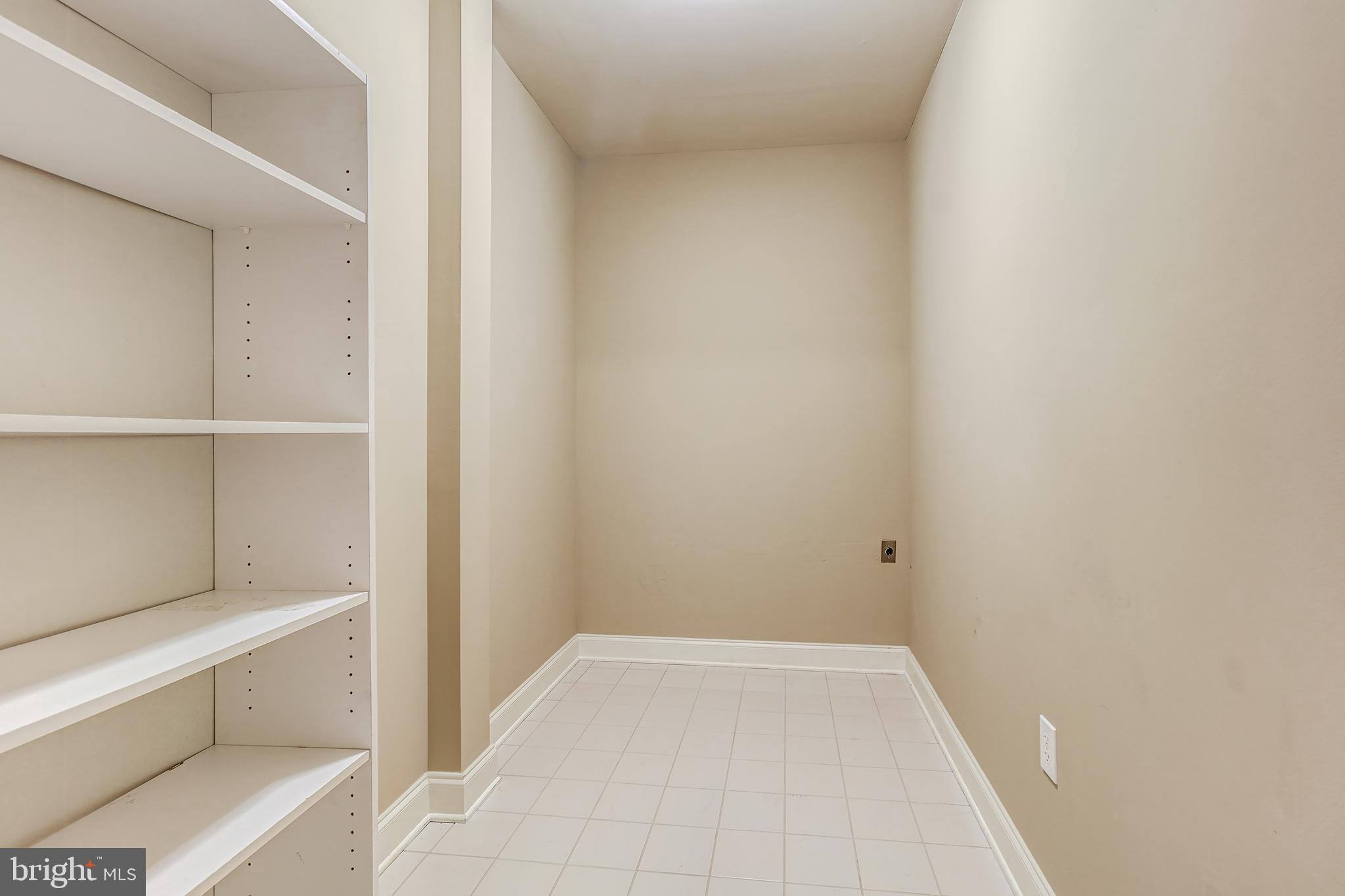 3030 Mill Island Parkway, Unit 109 Frederick, MD 21701 - Photo 7 of 20 a view of room with empty racks