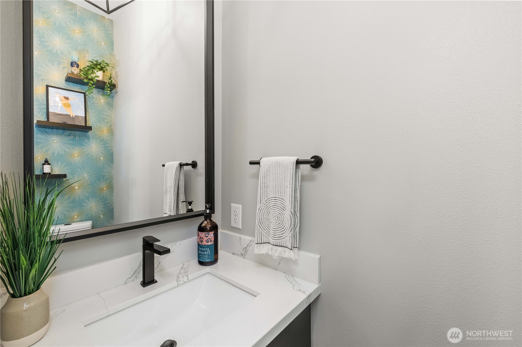 1208 Harrington Avenue Northeast Renton, WA 98056 - Photo 16 of 40 a bathroom with a sink and a mirror