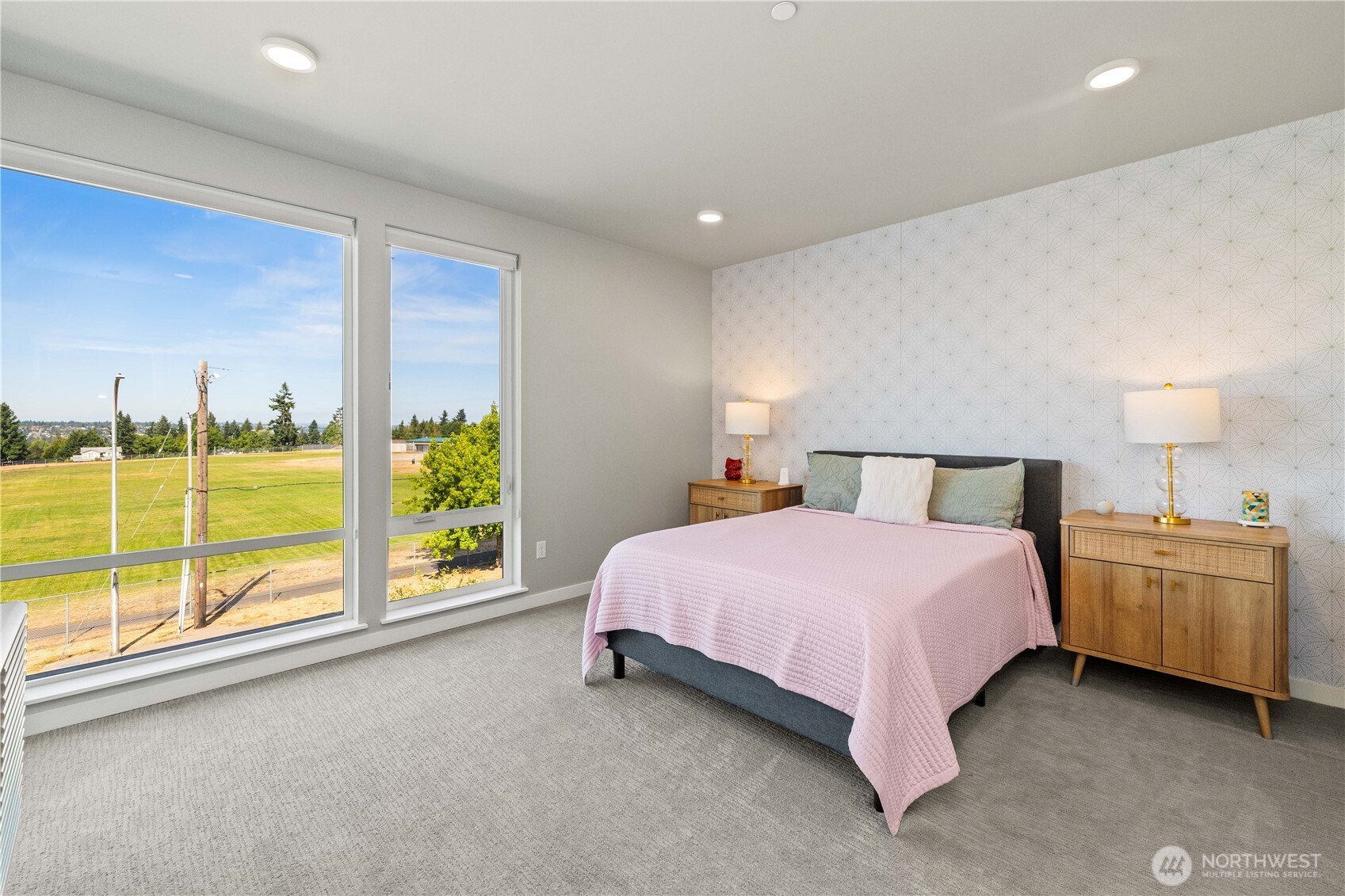 1208 Harrington Avenue Northeast Renton, WA 98056 - Photo 17 of 40 a bedroom with a bed and large cabinets