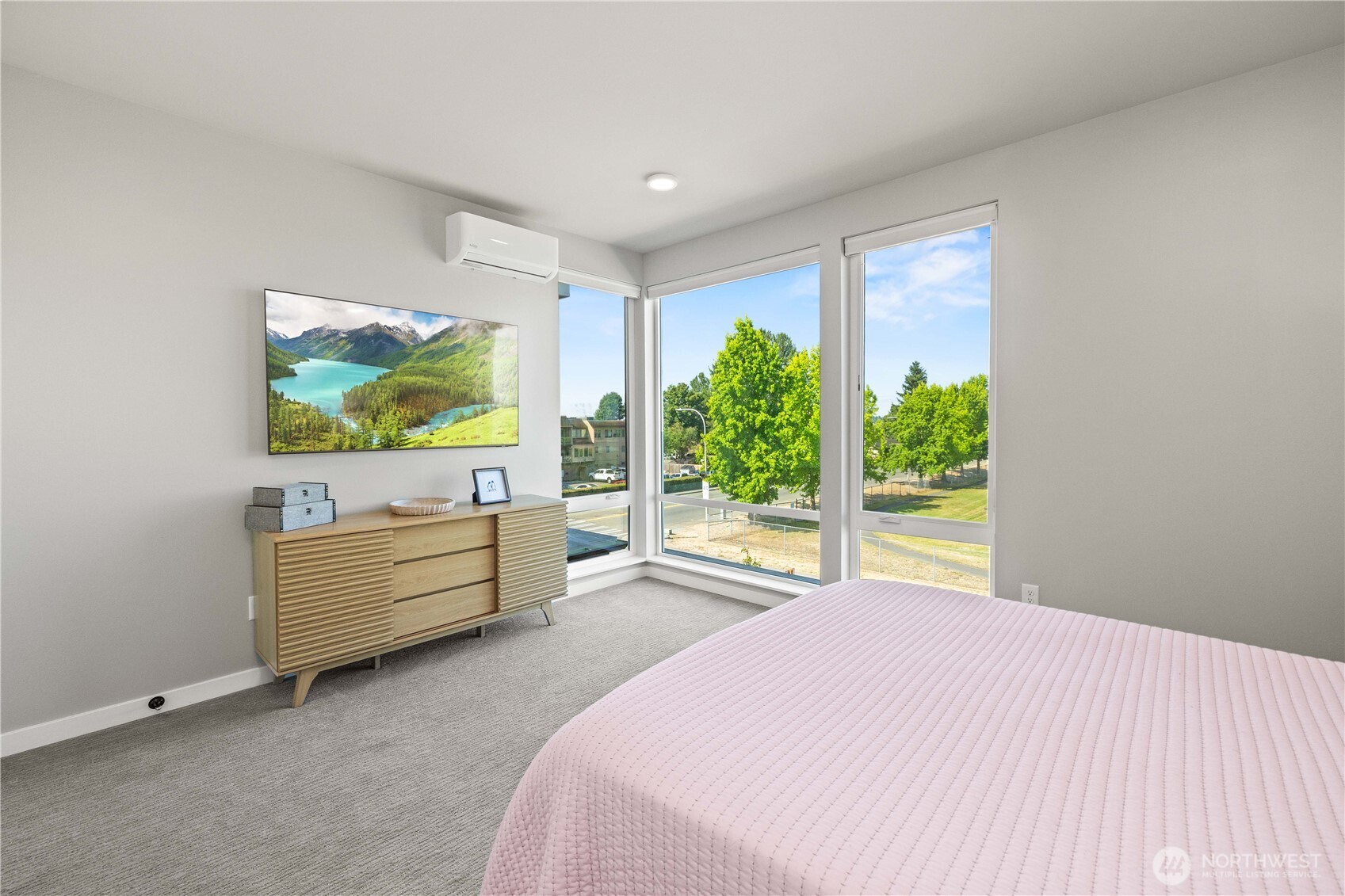 1208 Harrington Avenue Northeast Renton, WA 98056 - Photo 19 of 40 a bedroom with a bed and a flat screen tv