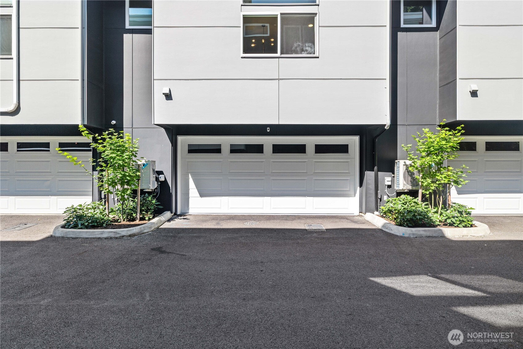 1208 Harrington Avenue Northeast Renton, WA 98056 - Photo 2 of 40 a front view of a house with garage