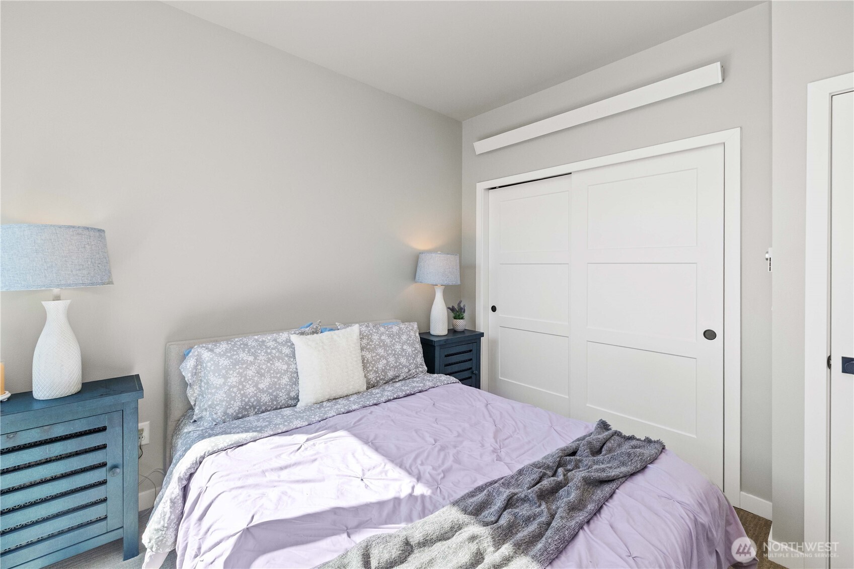 1208 Harrington Avenue Northeast Renton, WA 98056 - Photo 22 of 40 a bedroom with a bed and a night stand